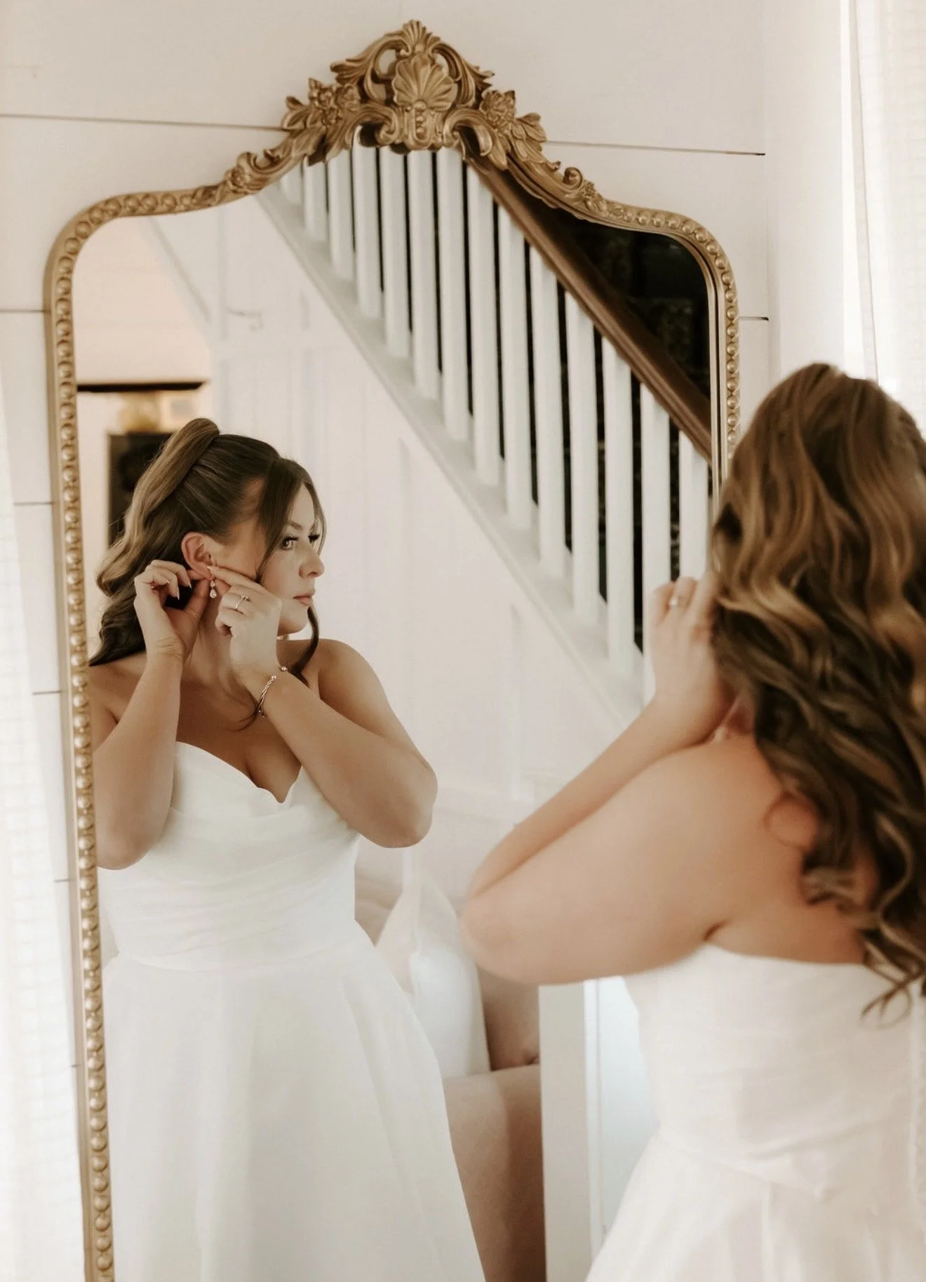 Bride at mirror with spray tan