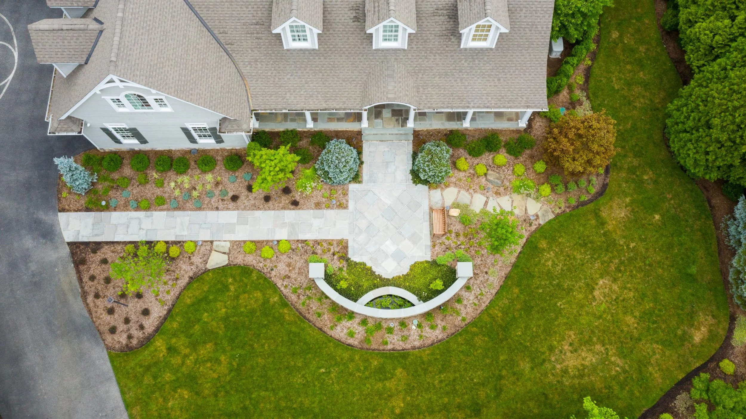 Front yard landscape design with plantings in Saddle River, NJ