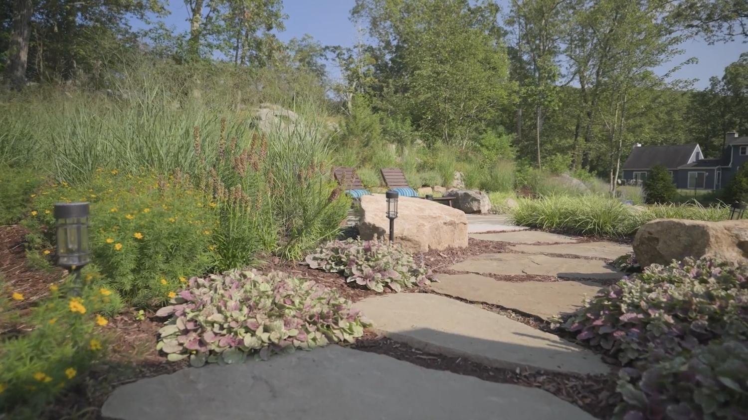 Seasonal prairie garden flanking outdoor entertainment space in West Milford, NJ.jpg