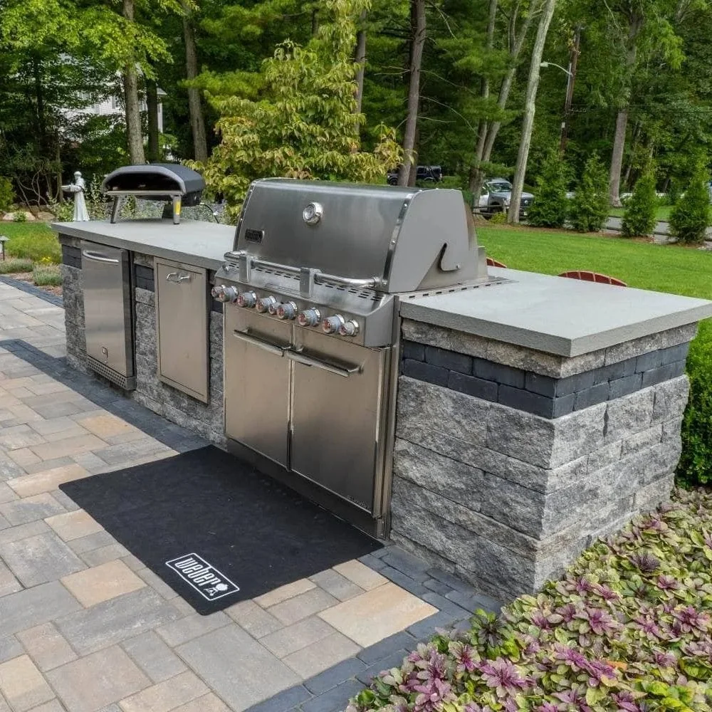 A stunning patio featuring a custom grill station built by an experienced outdoor kitchen contractor in Ho-Ho-Kus, NJ