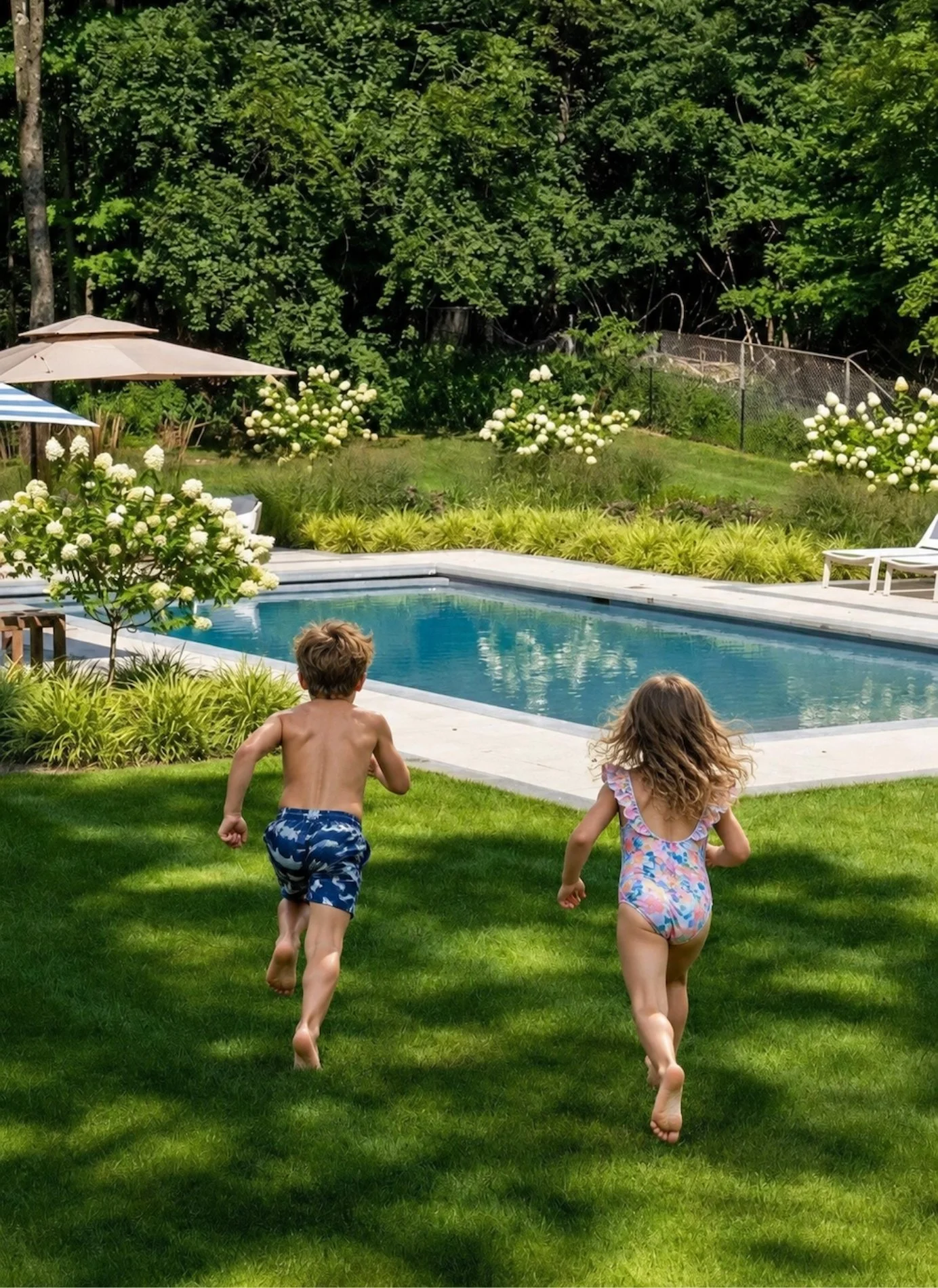 Kids running towards pool by Magic Landscaping.jpg