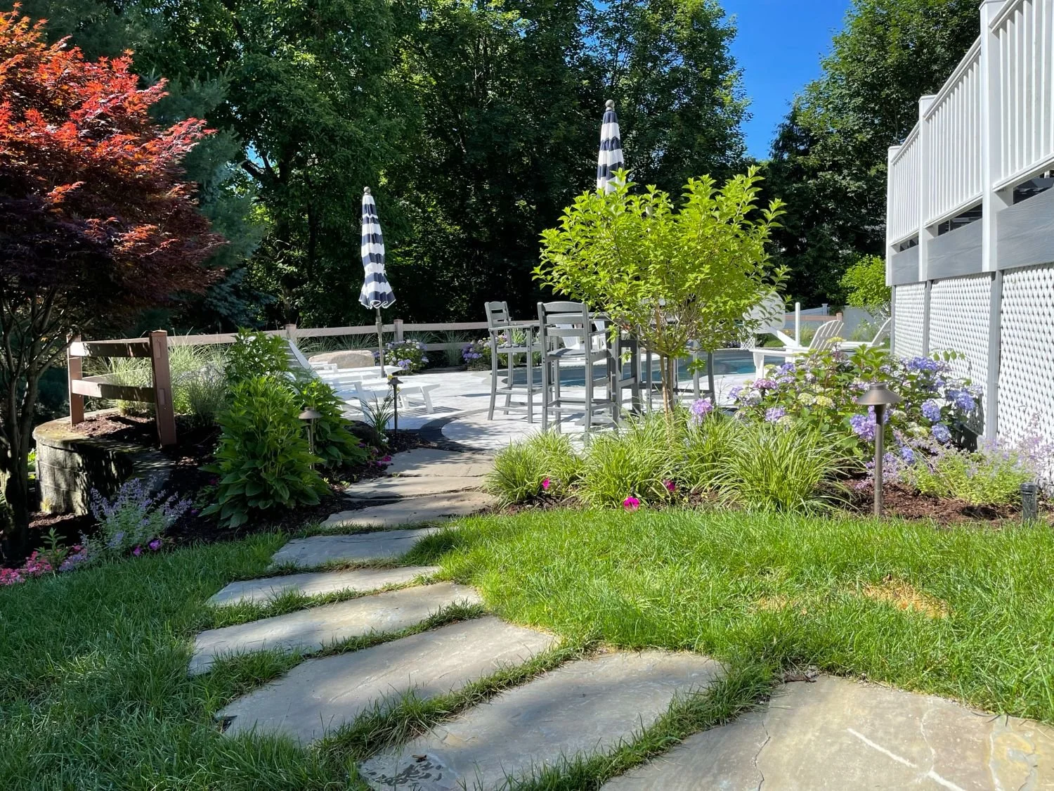 Mixed stone pieces forming a natural pathway with organic spacing in Franklin Lakes, NJ
