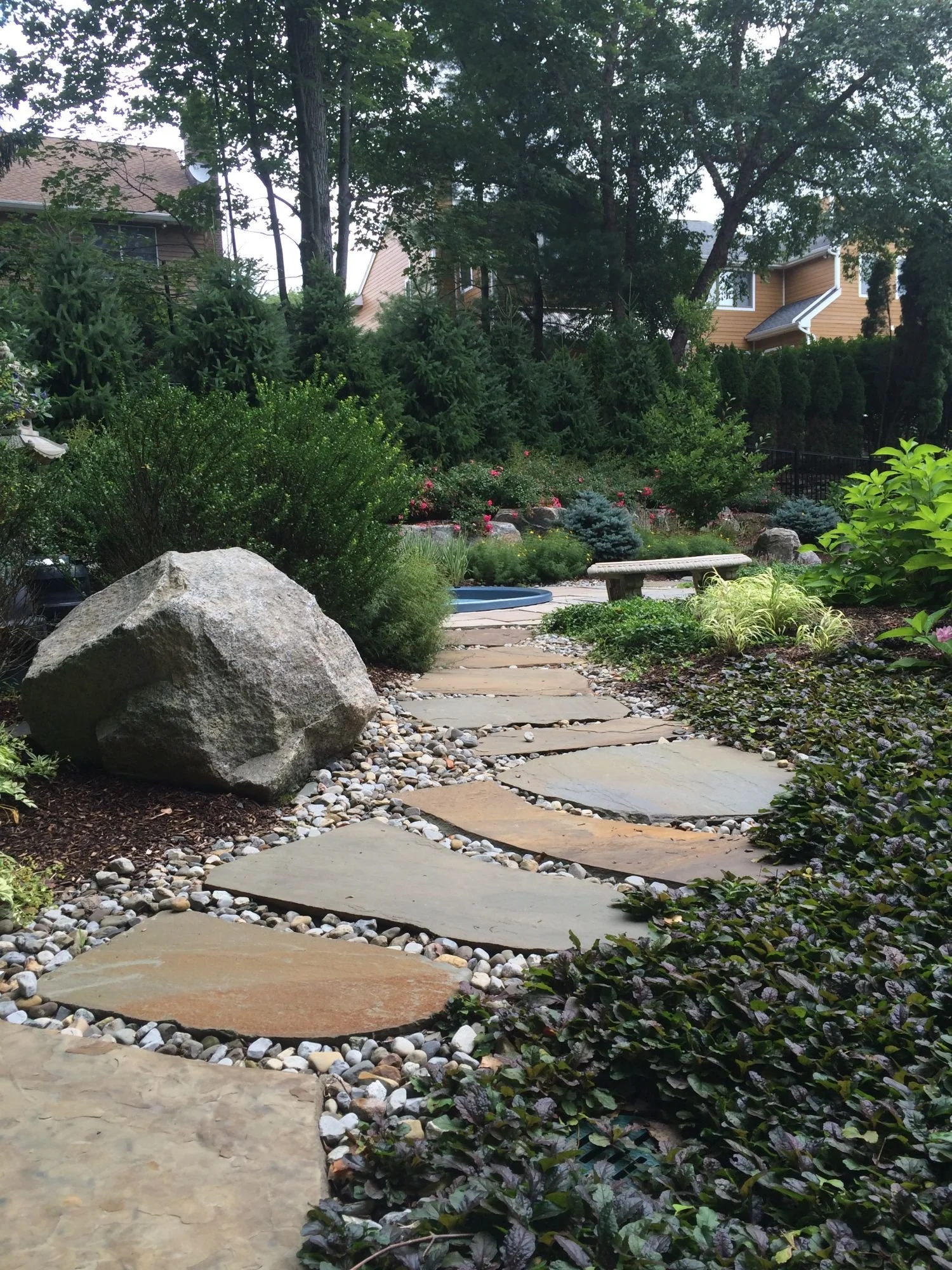 Natural stone walkway creating a relaxed pathway feel in Oradell, NJ