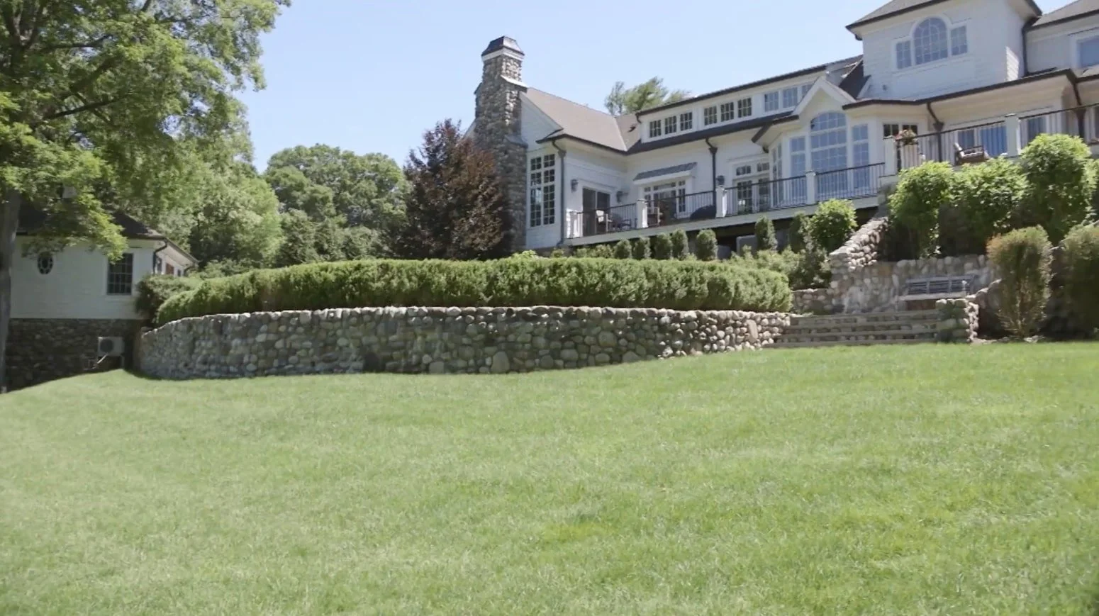 Luxury landscape design with balance of open lawn and refined hardscape in Saddle River, NJ.jpg