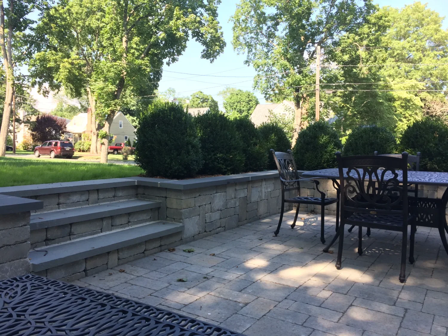 Retaining wall used to define planting zones and improve yard drainage in Oradell, NJ
