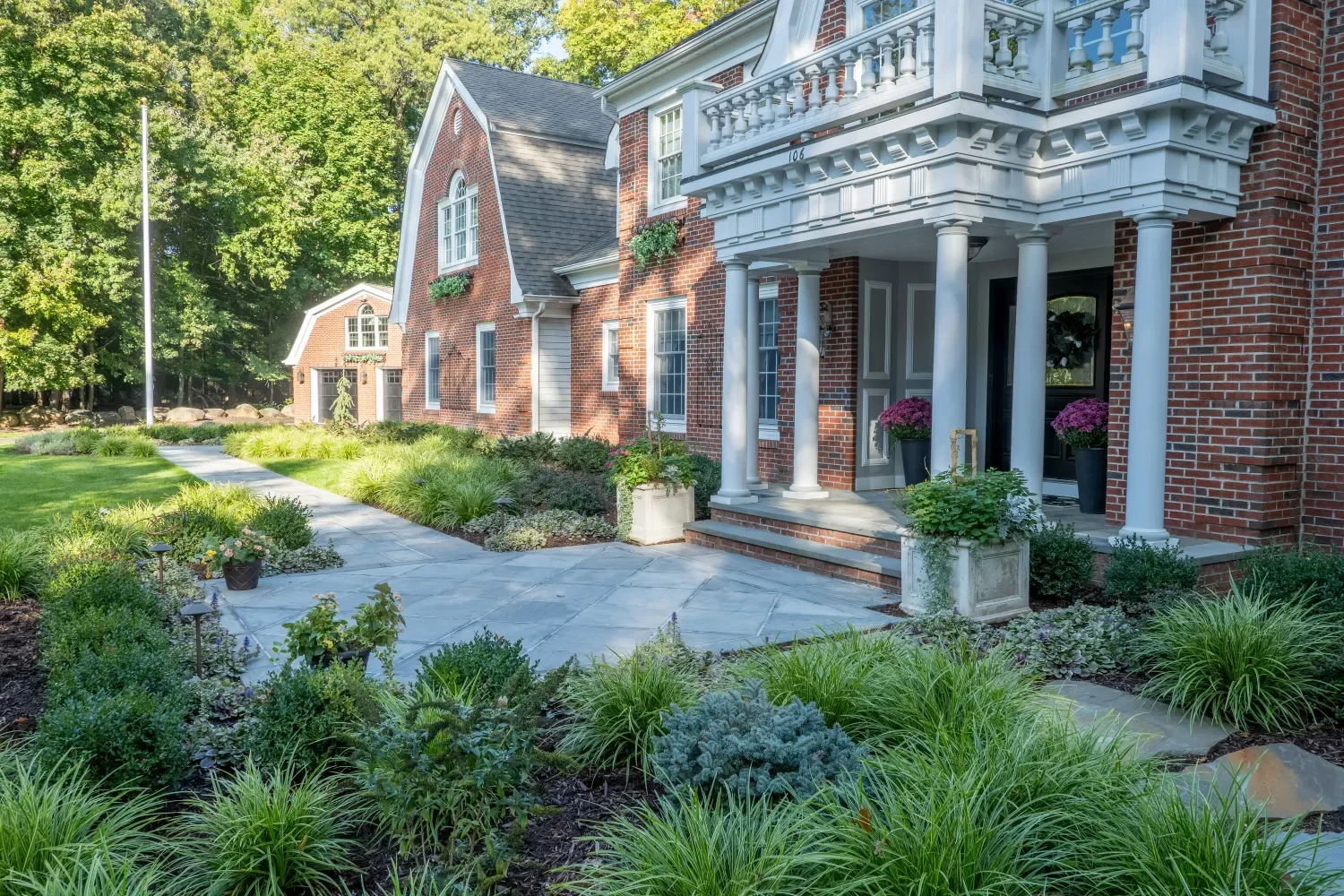 front yard paver walkway with brick inlays and layered plantings in Ridgewood, NJ