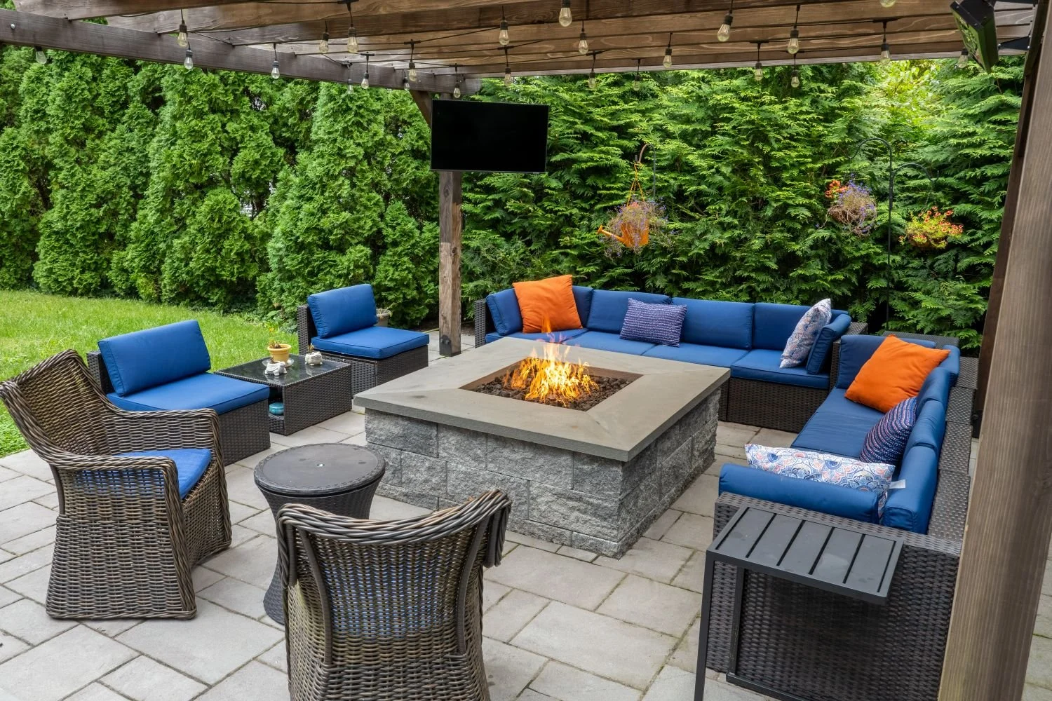 A fire pit built into a paved patio for year-round use in Wyckoff, NJ