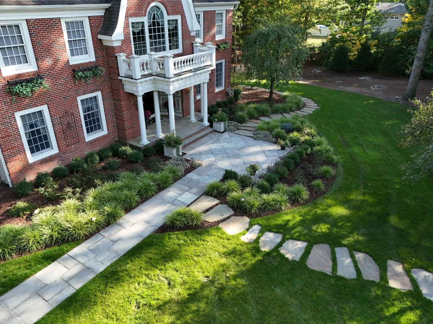 Plantings designed to create a sense of enclosure and calm in a garden room in Oradell, NJ