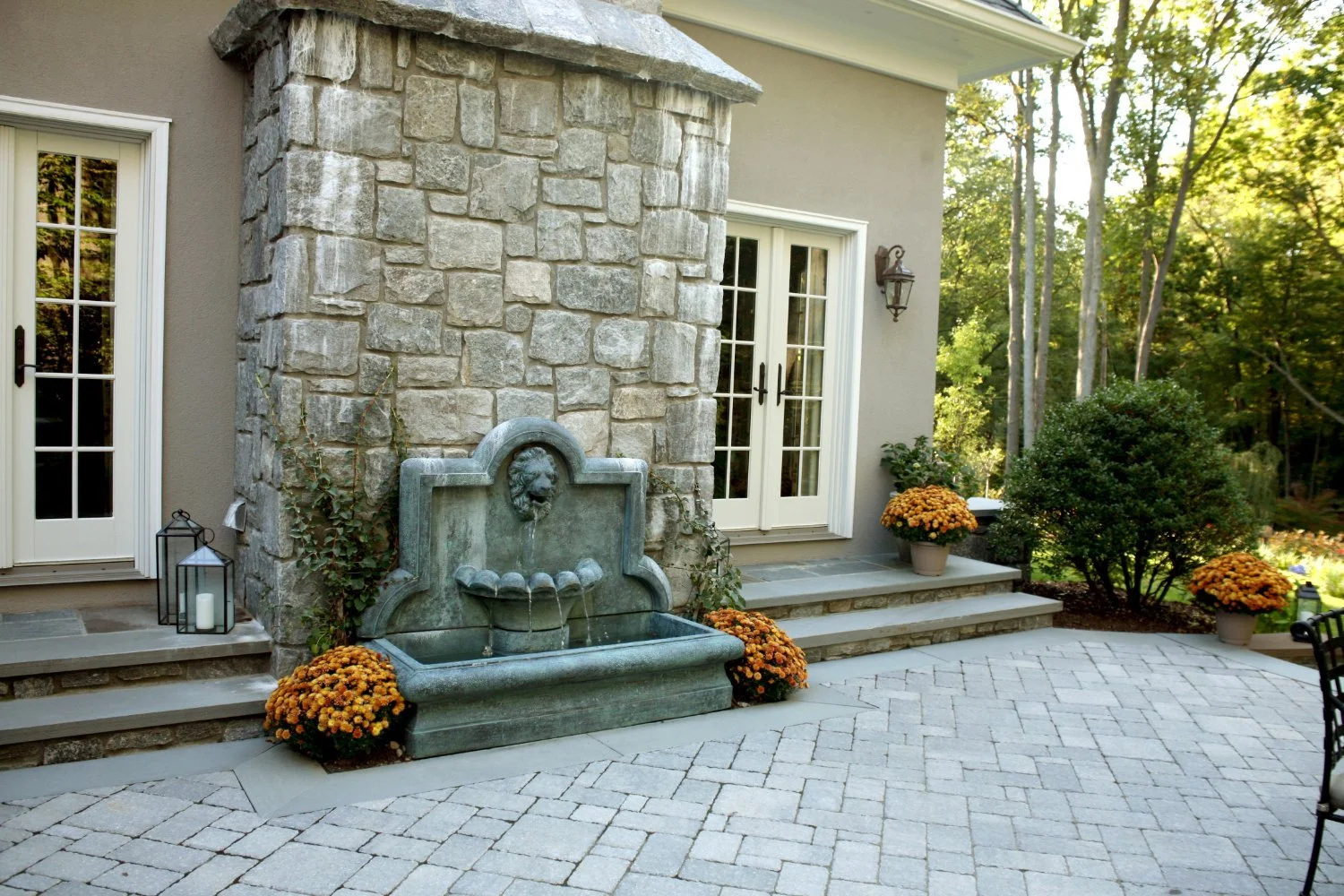Custom wall-mounted water fountain integrated into a stone façade in Franklin Lakes, NJ