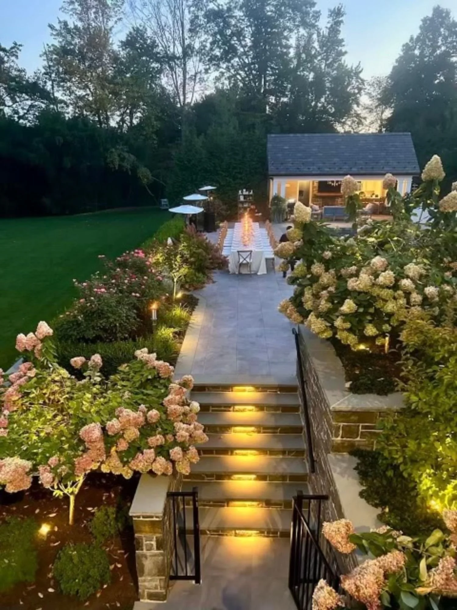 Layered plantings guiding views and circulation in a garden room layout in Westwood, NJ