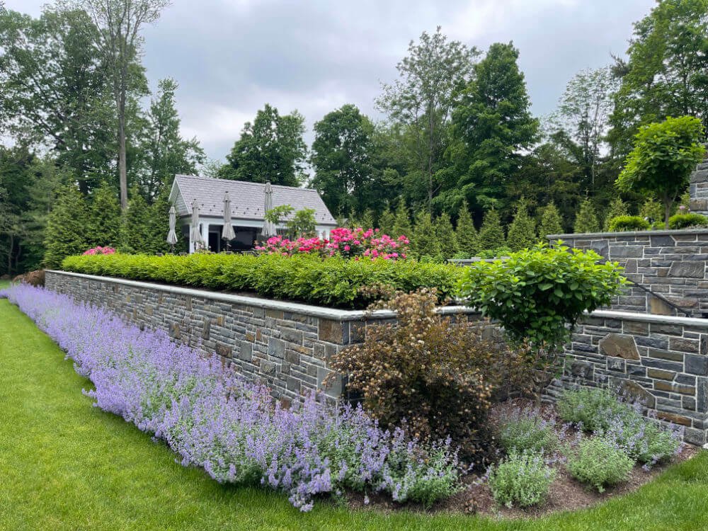 Retaining wall constructed from stone