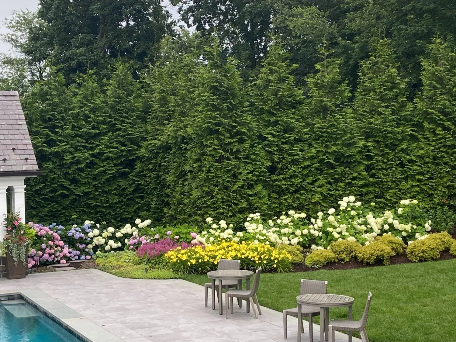 Plantings designed to soften walkways and shape outdoor rooms in Waldwick, NJ