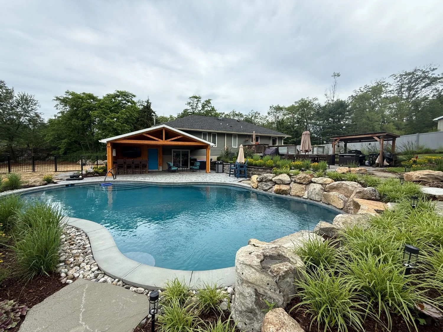 Paver patio with discreet linear trench drain for efficient water management in Woodcliff Lake, NJ