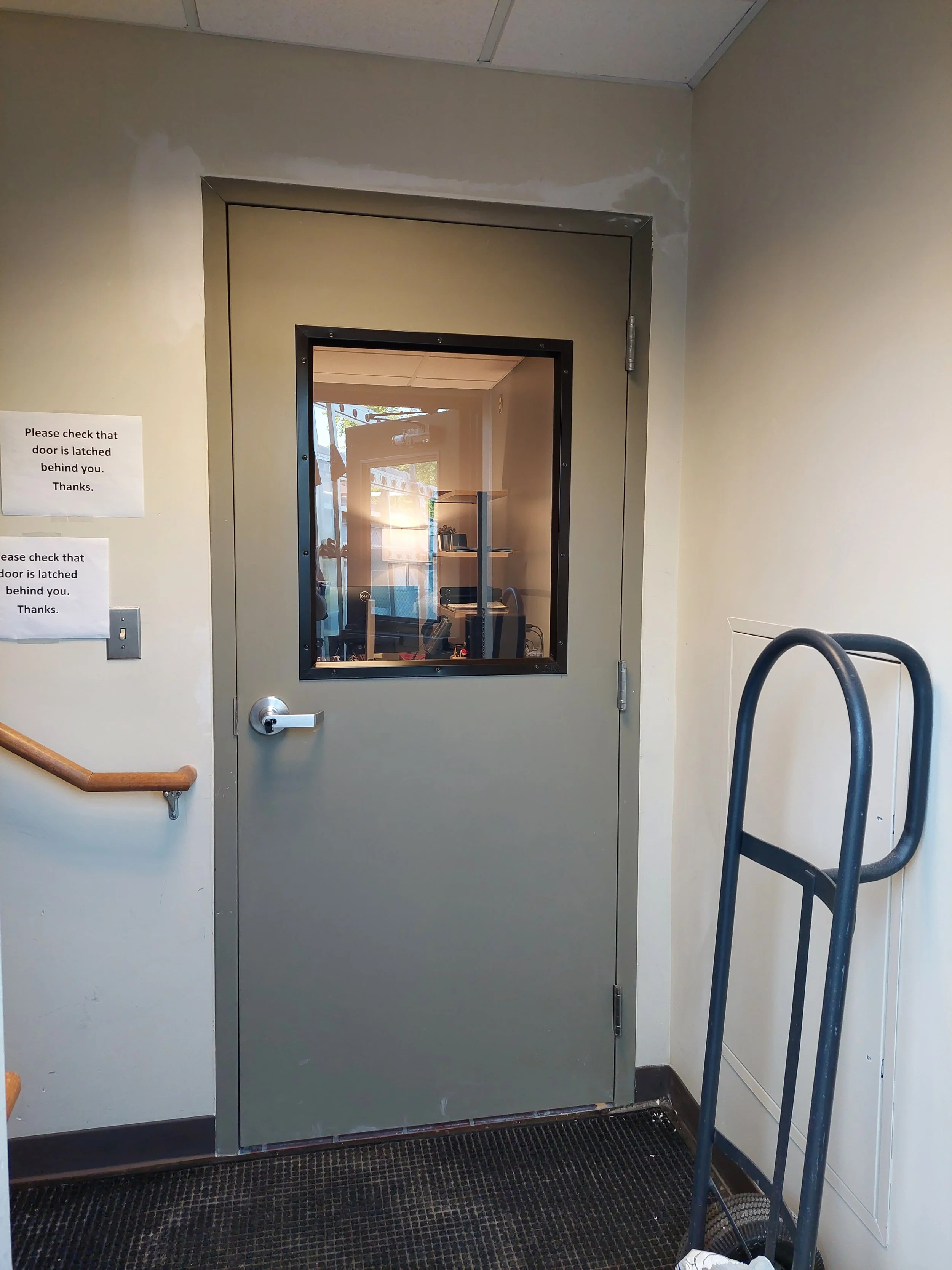 New steel door with window in commercial building