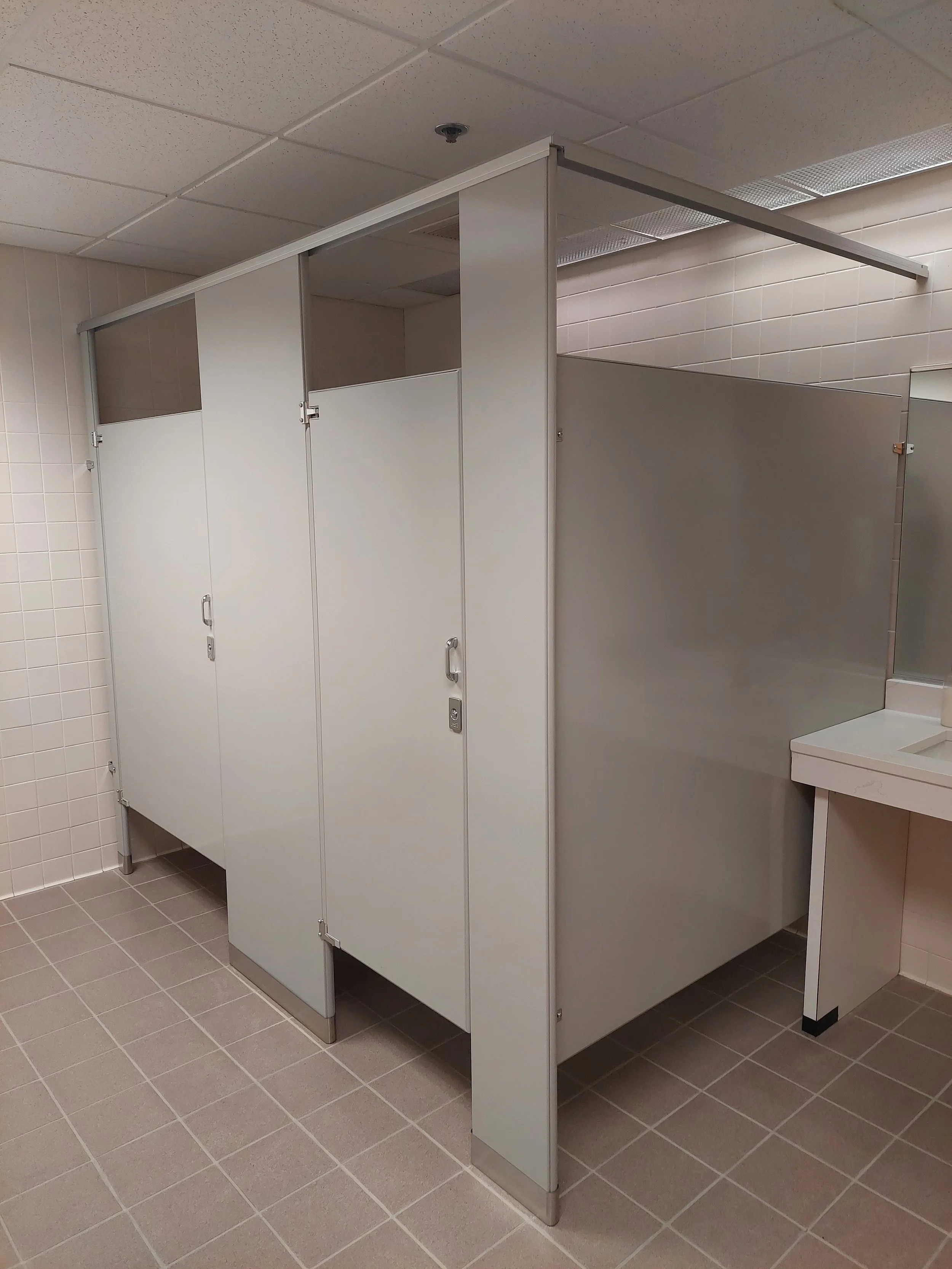 New public restroom stalls in office building