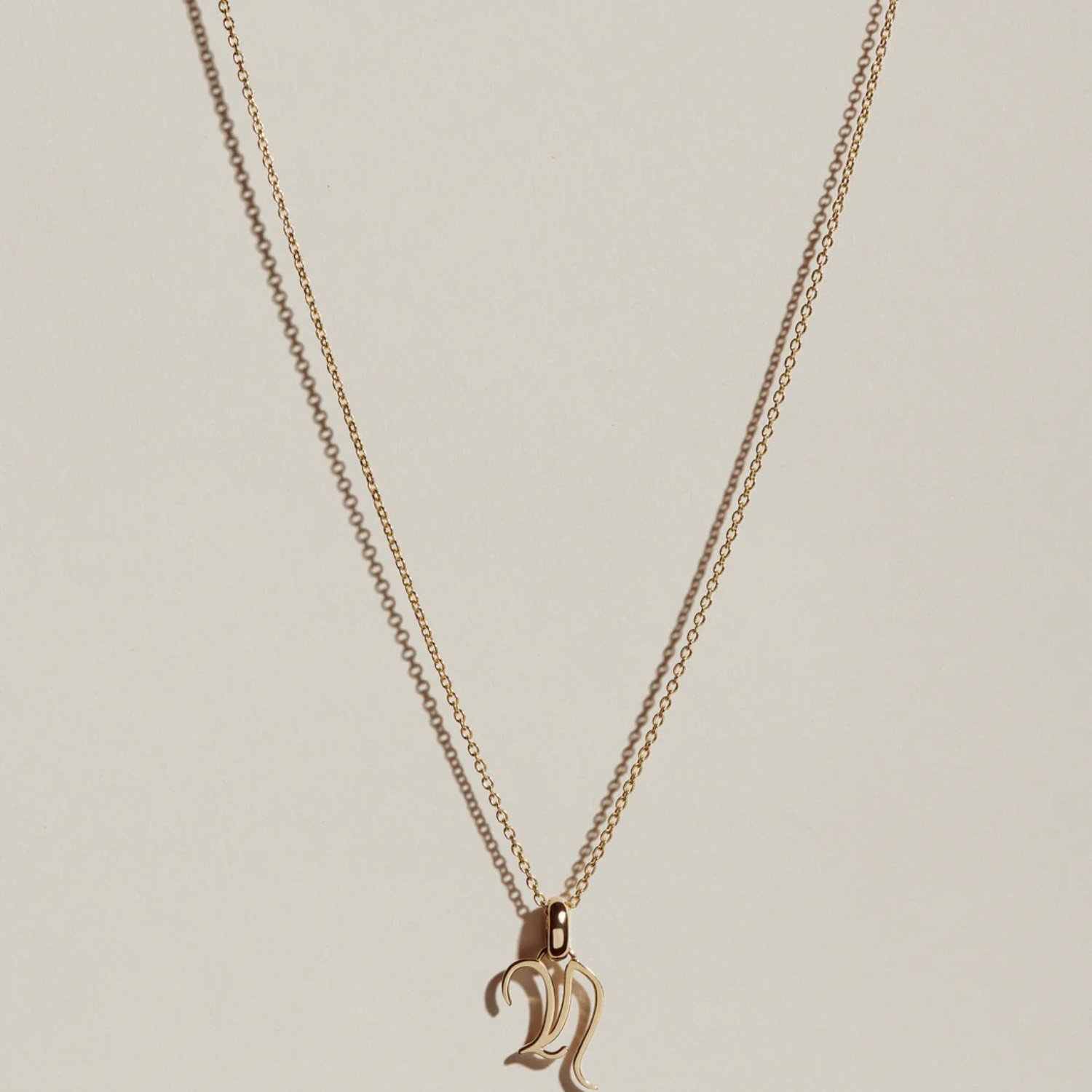 processed_JHannah_Gothic_Letter_Charm_N_Gold_2237_1_1059x1059_crop_center.jpeg