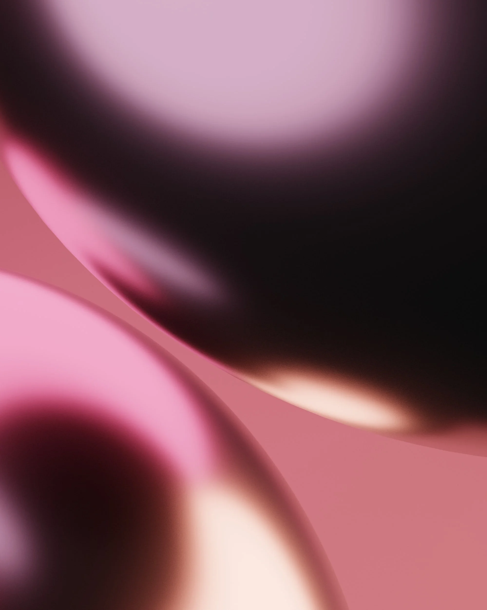 Close-up abstract image featuring soft pink and black colors with smooth, curved shapes.