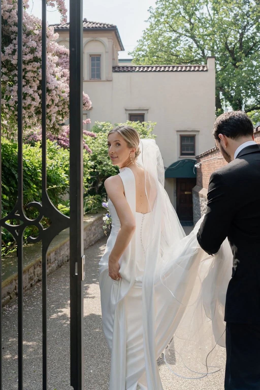 Italy inspired portrait of bride walking with her groom