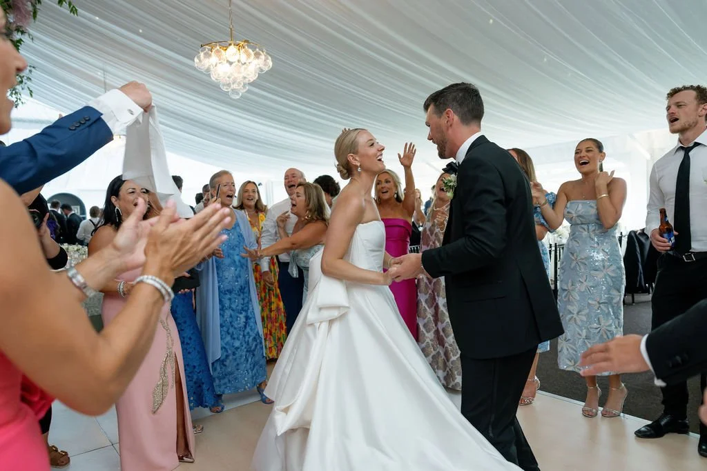 Sagamore-resort-luxury-wedding-bride-groom-dancing-with-guests.jpg