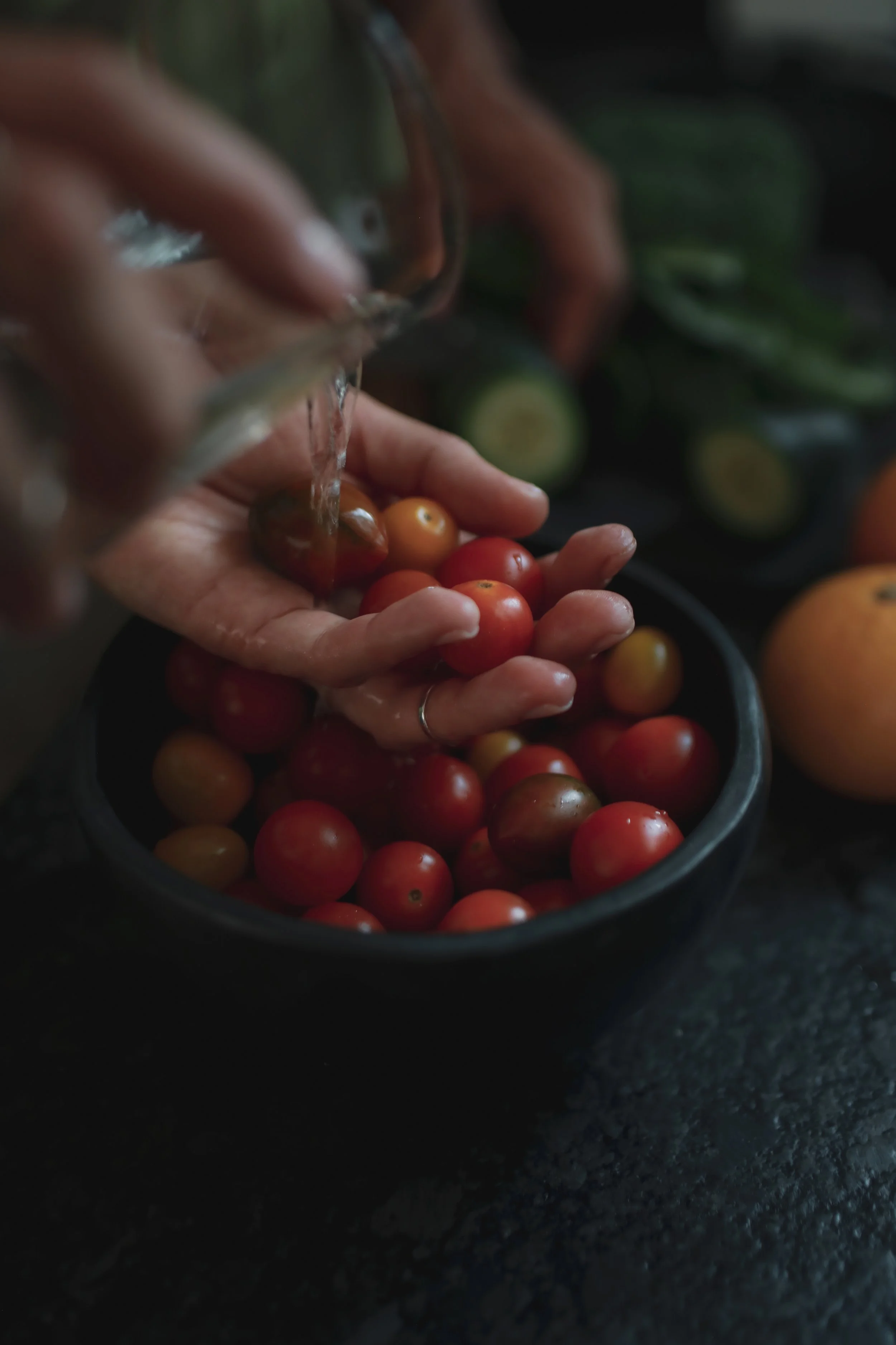 Fruits soaking in ionized alkaline water from a Kangen system for cleaner, safer produce.