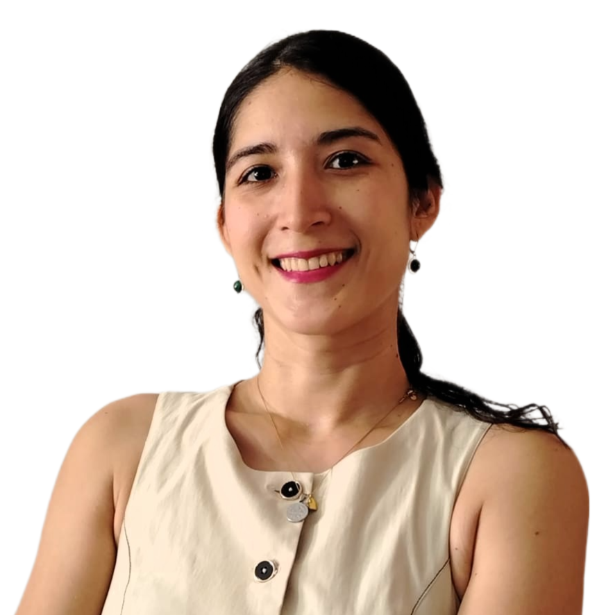 A woman smiling and standing with her arms crossed, wearing a sleeveless top, earrings, and a necklace against a plain background.