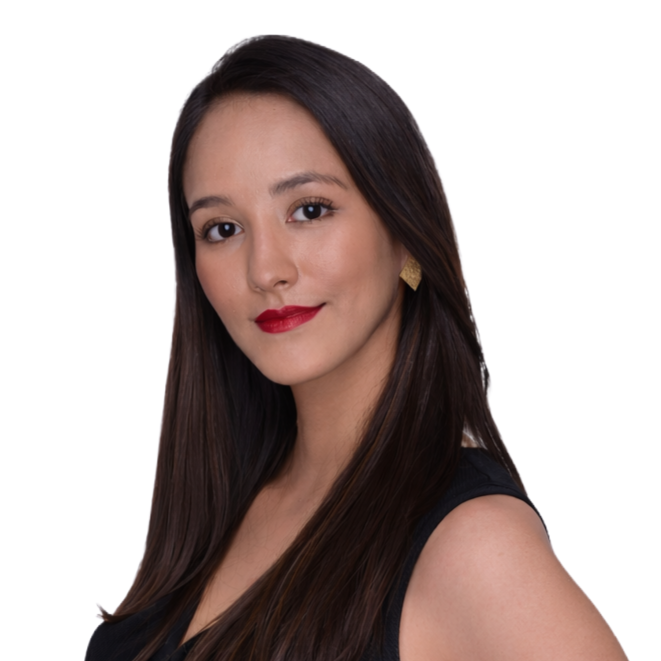 Portrait of a young woman with long dark hair, wearing a sleeveless black top, looking at the camera with a slight smile against a white background.
