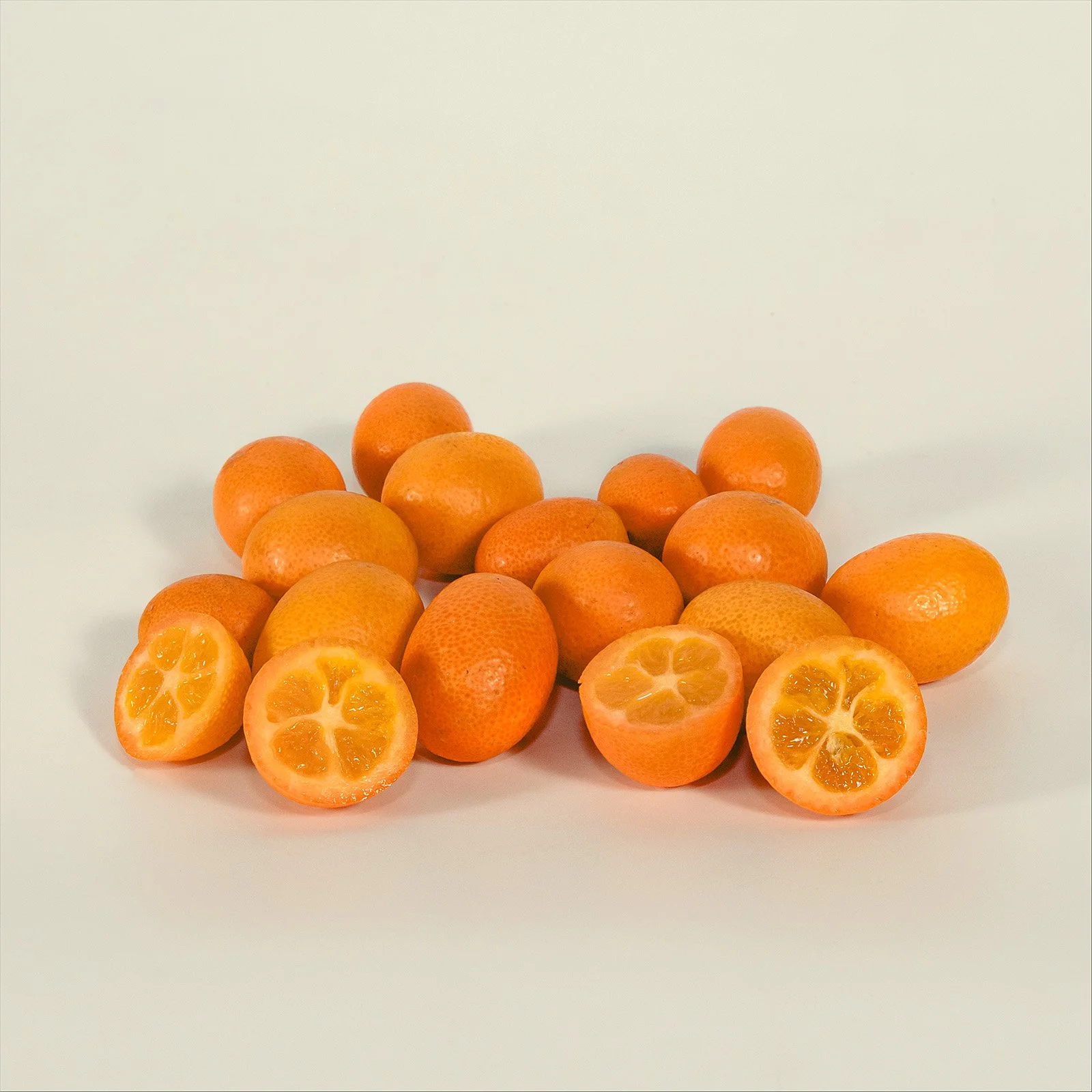 Single kumquat fruit, small golden citrus wholesale, fresh tropical produce by Ecoripe Tropicals