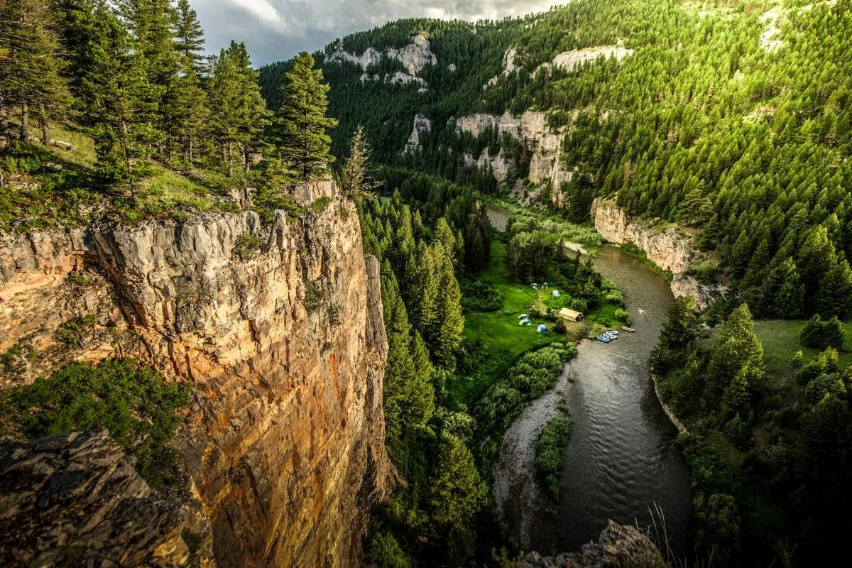 Drift boats floating through the Smith River canyon during early summer in Montana