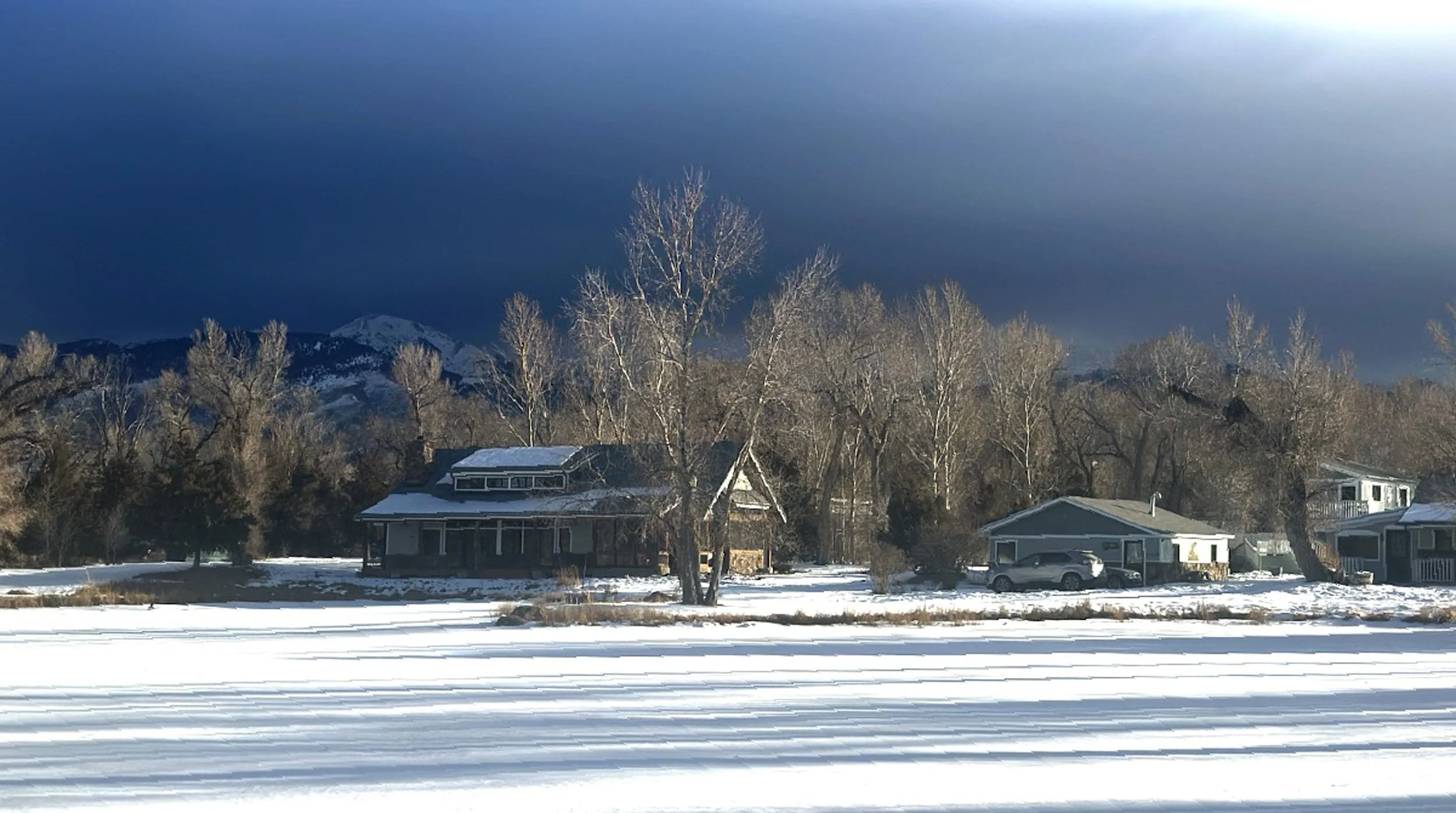 Montana winter landscape near Healing Waters Lodge with snow-covered riverbanks