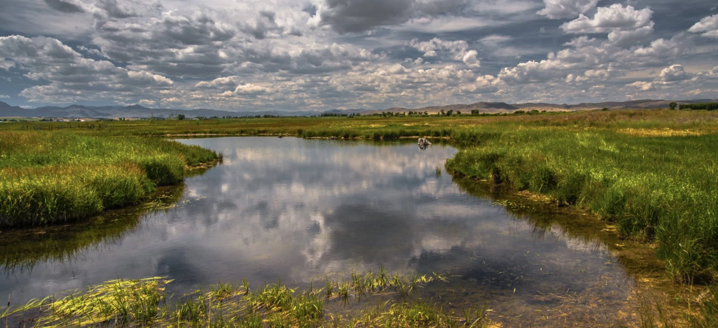 Spring snowpack and early runoff landscape near Healing Waters Lodge in Montana