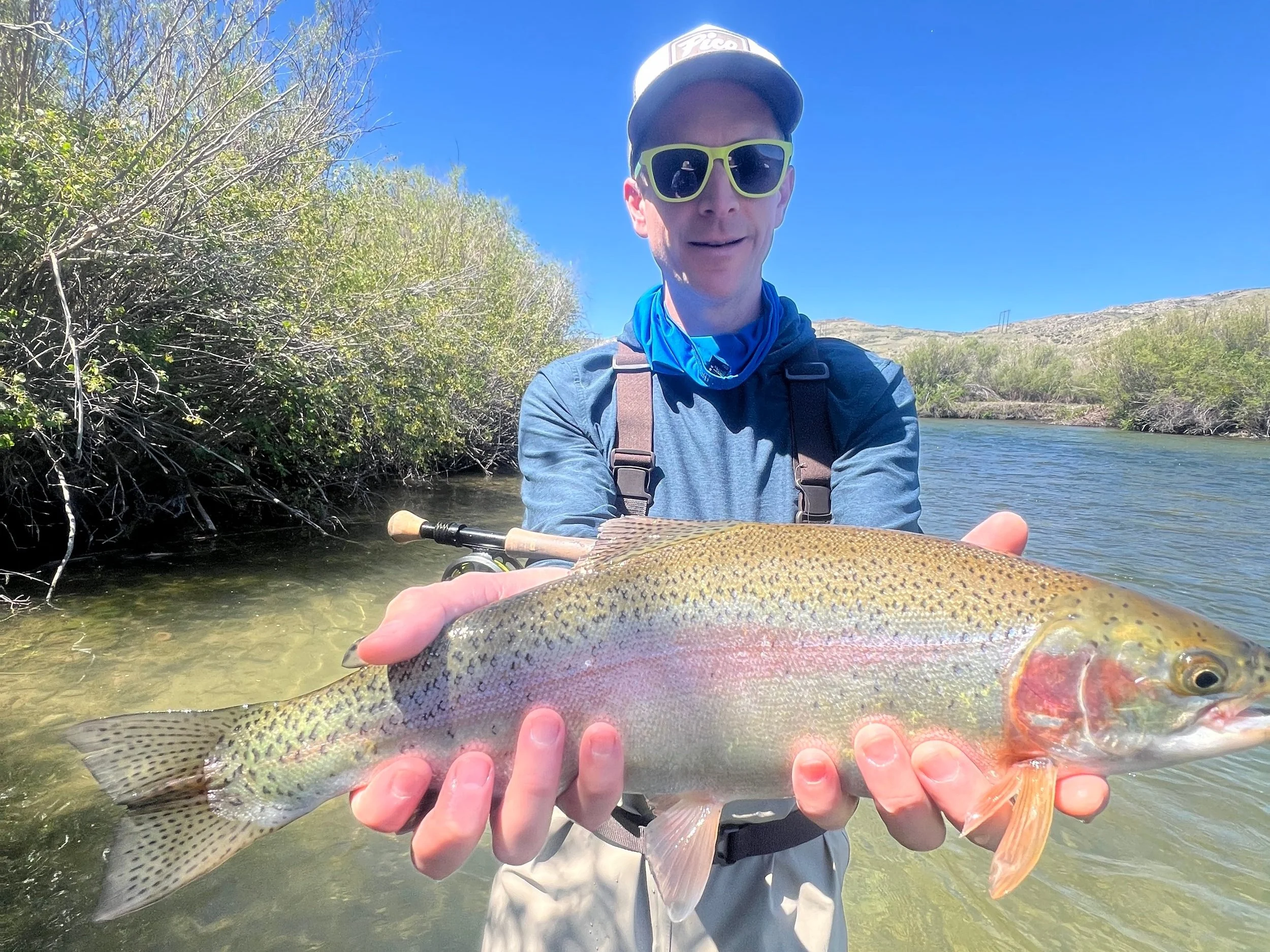 Early season fly fishing on the Beaverhead River with a guide and client casting to rising trout