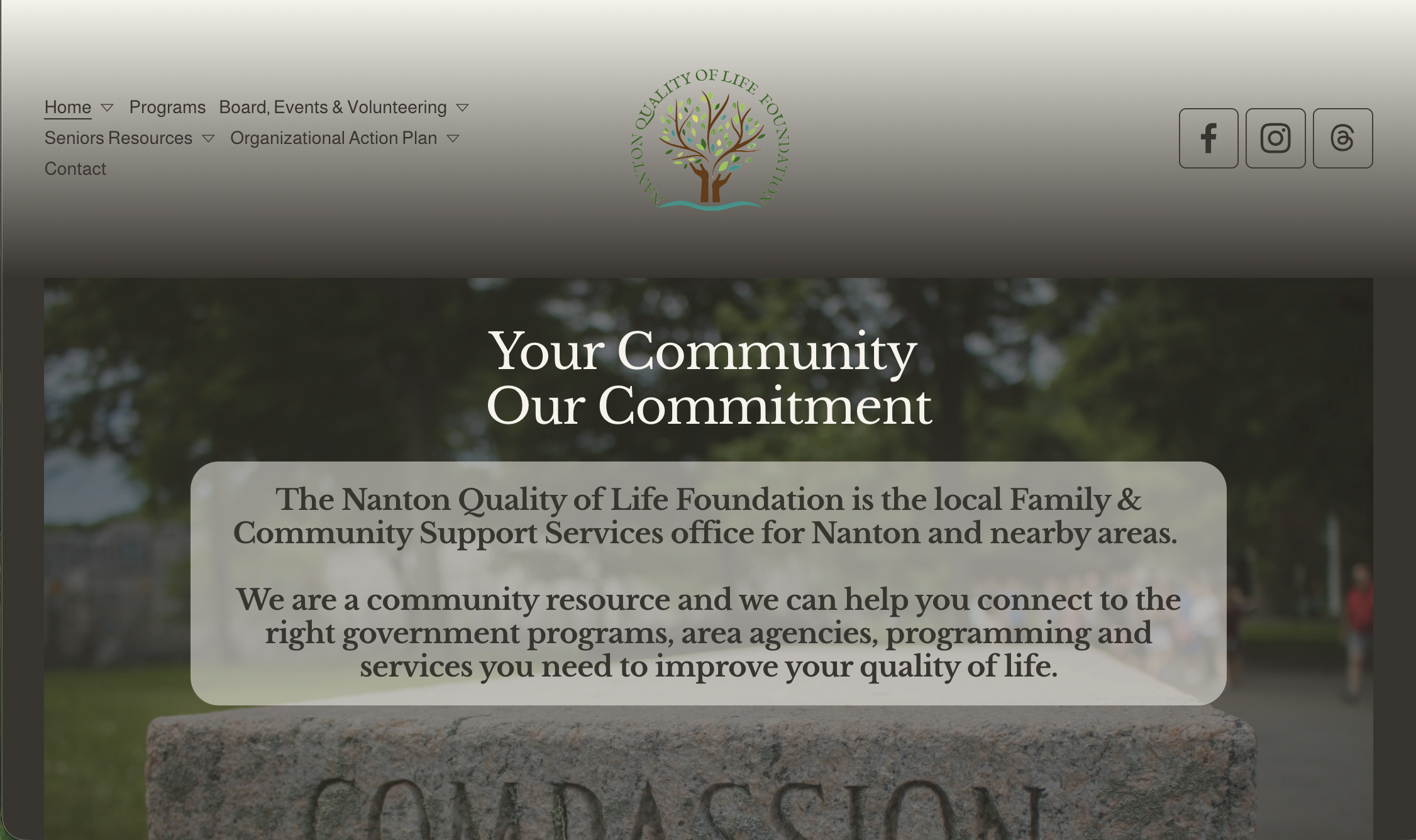 A webpage with a mission statement promoting inclusivity and well-being for individuals, families, and communities in Nanton and the surrounding area. The background features a scenic mountain landscape, and the text includes links to the 2025 Report