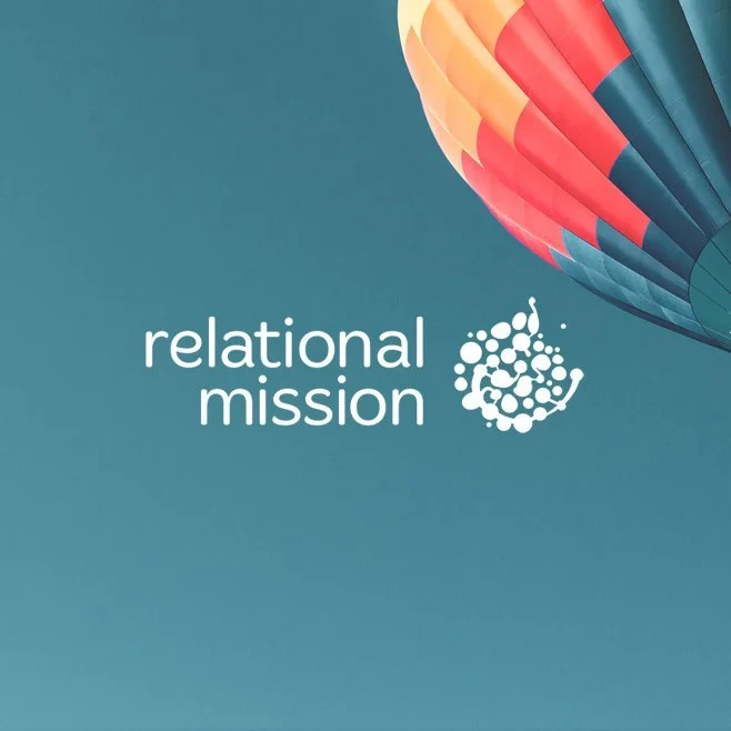 A teal background with the logo and text 'relational mission' next to a graphic of a smiling face made of dots, and a colorful hot air balloon partially visible in the top right corner.