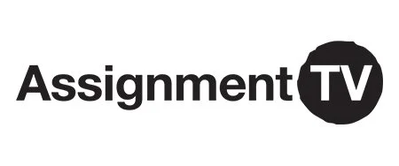 The logo for Assignment TV.