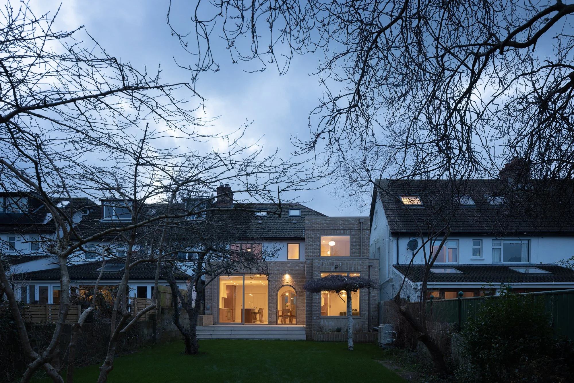  Studio AND _ Light Arc House_Rear Elevation Nighttime.jpg