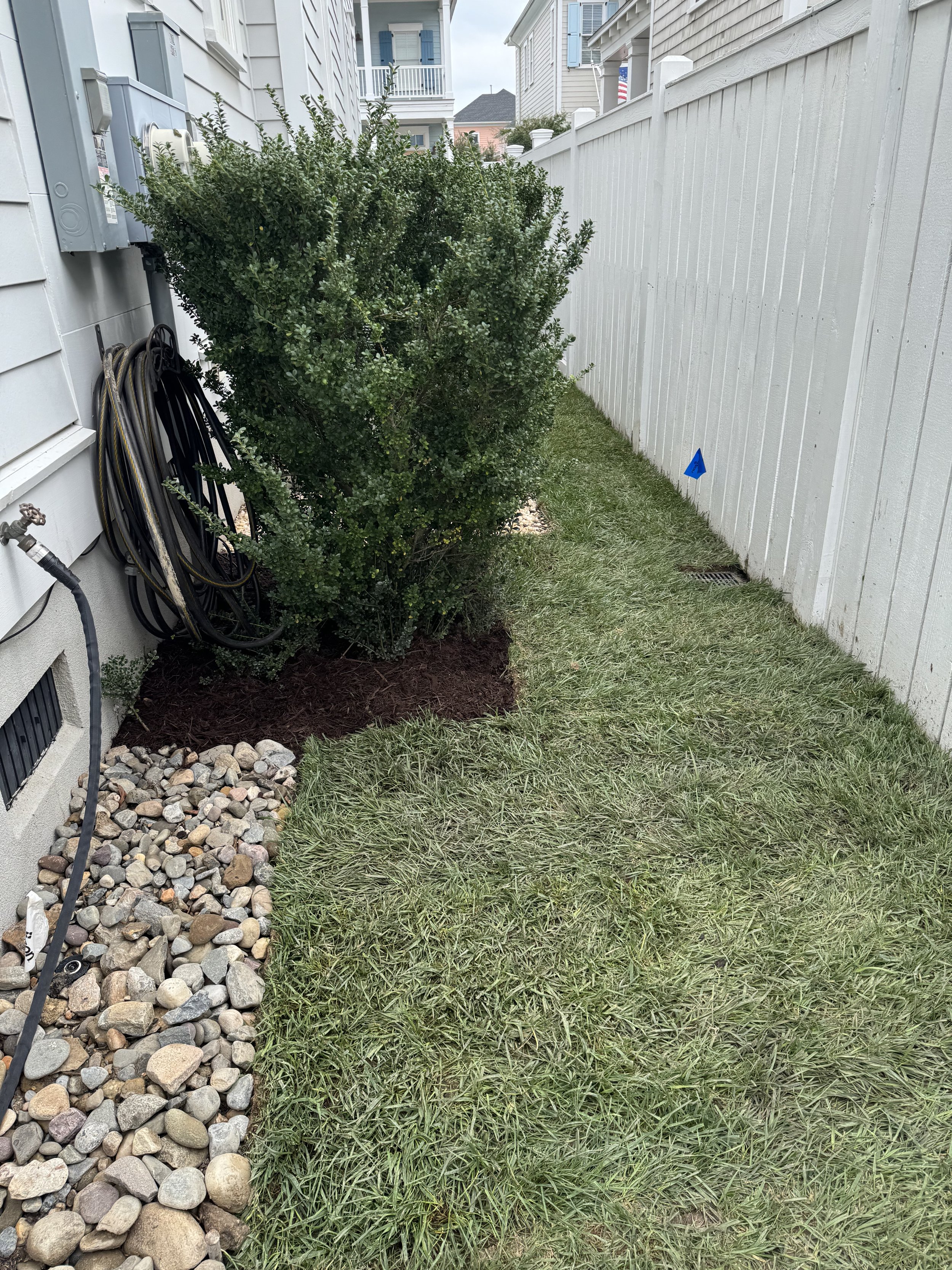After — French drain and sod installation for a flood-prone area: regraded runoff path, gravel/pipe system, and a stable lawn.