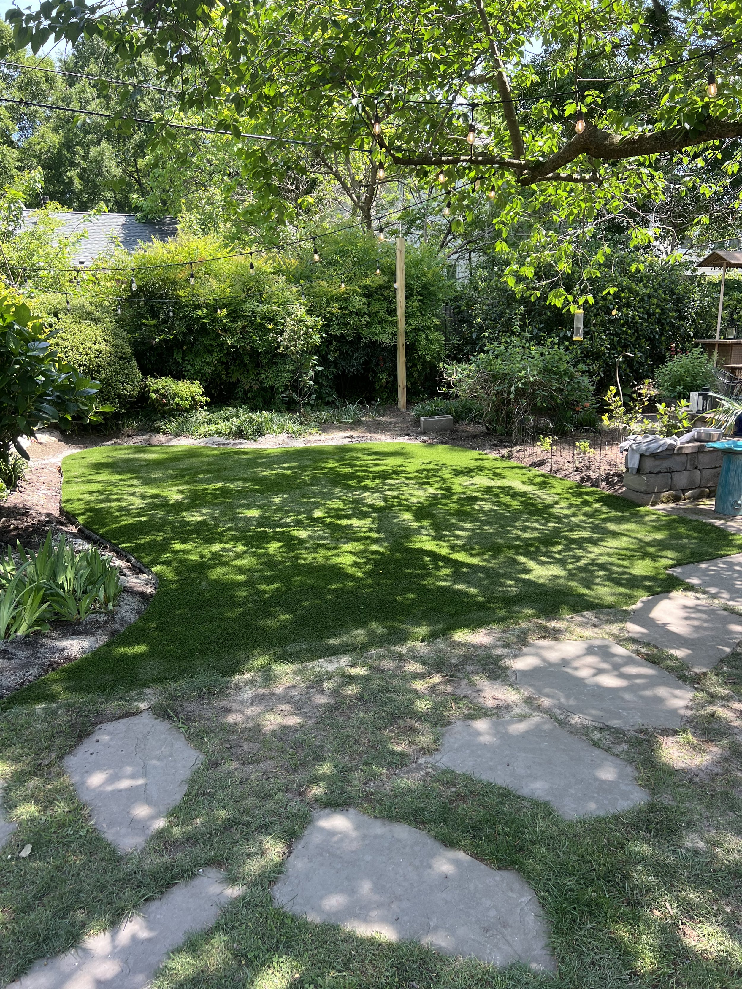 Process — Artificial turf install for a high-traffic pet area: rebuild base, improve drainage, secure seams, add odor control.