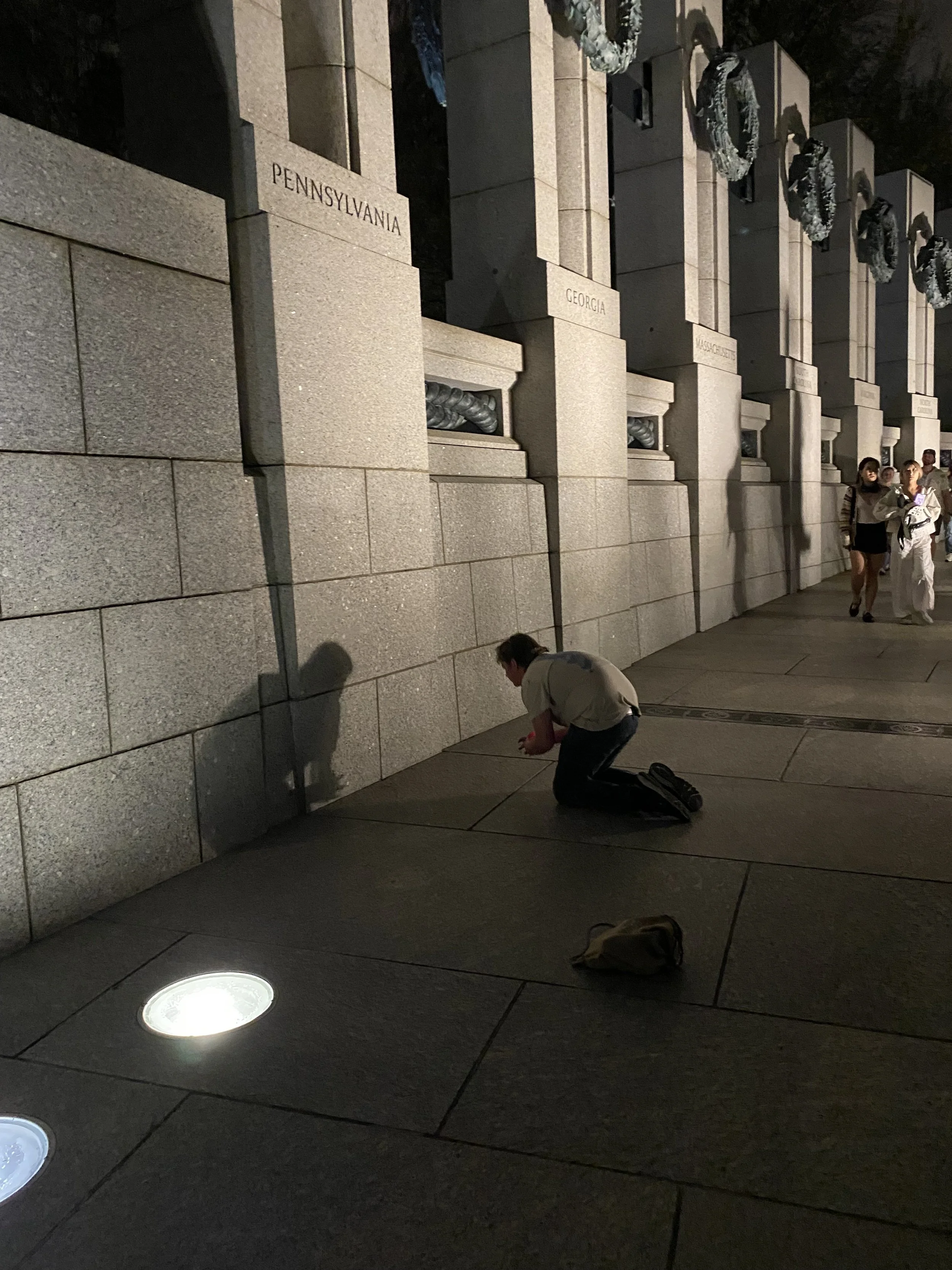 The pillars at the WWII memorial, with a wreath and the names of each state.