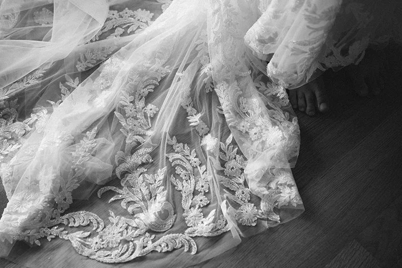 Wedding details with bridal dress