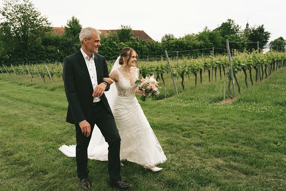 Bride and Father on their way to the ceremony in the Wineyards at Lake Constance