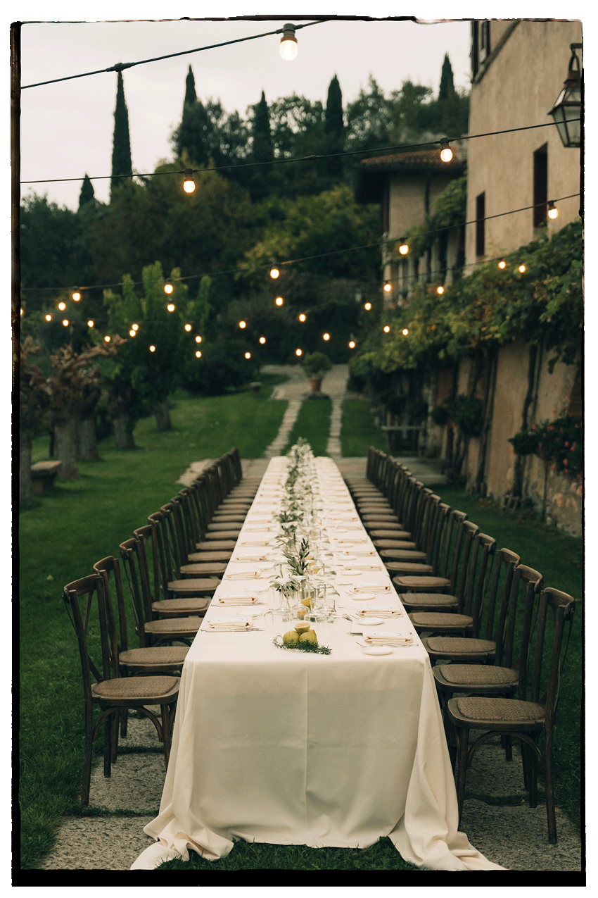 Wedding tablesetting in the garden of villa arcade at lake Garda in Italy