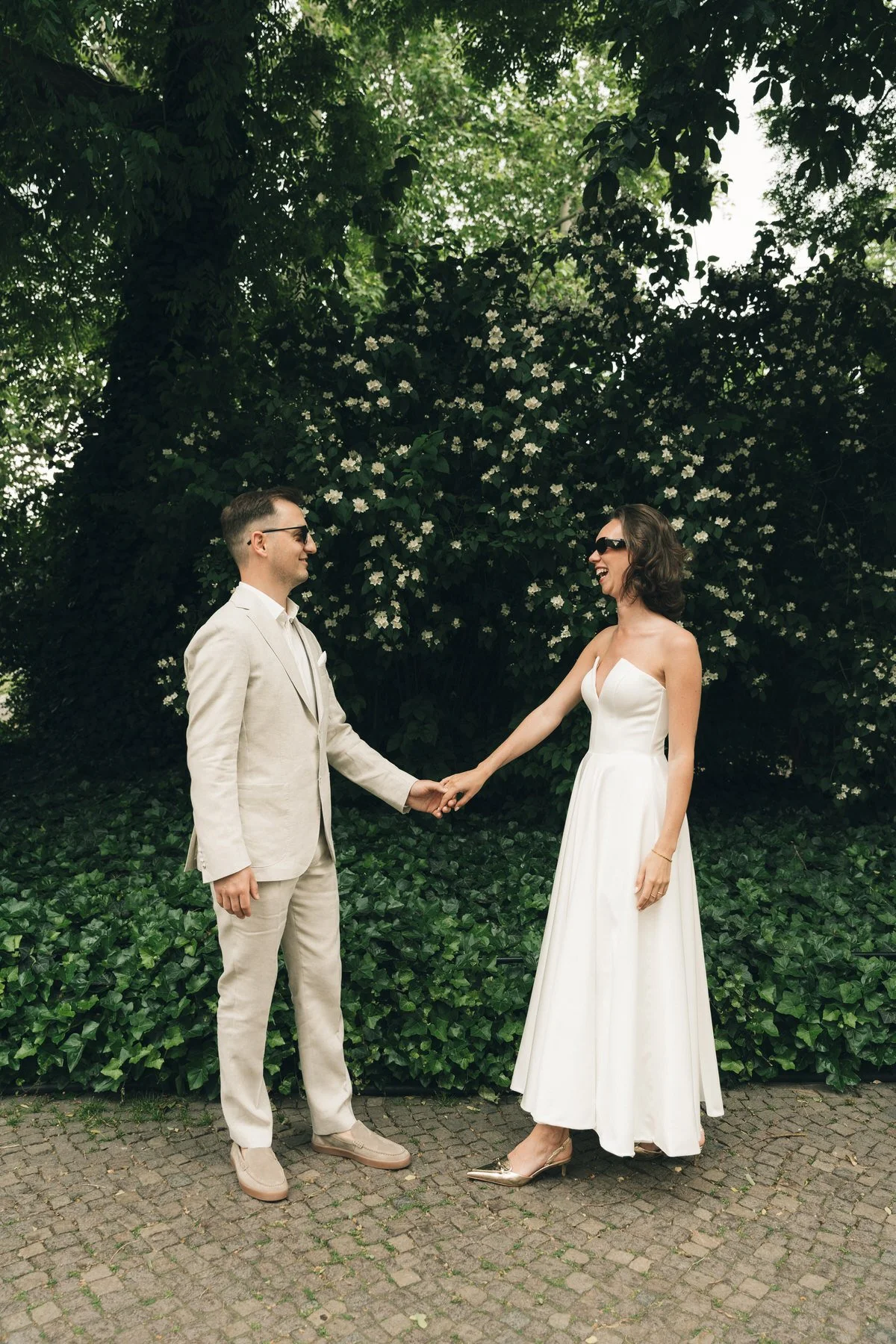 bride and groom holding hands in Leipzig