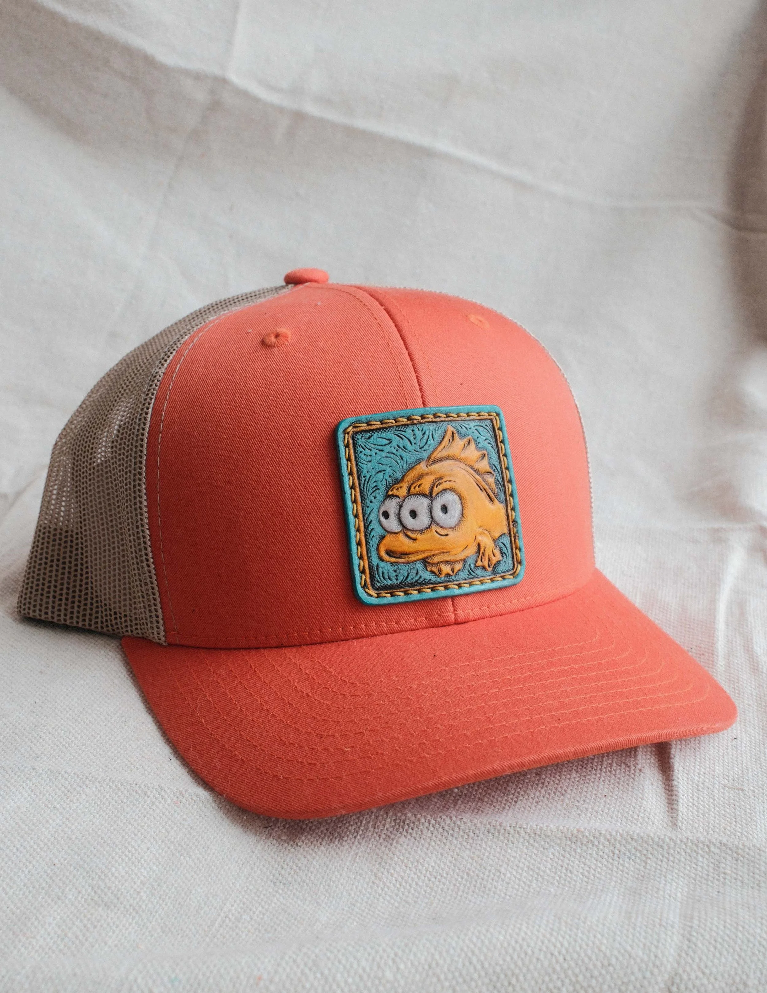 3 Eyed Fish Tooled Leather Patch Trucker Hat
