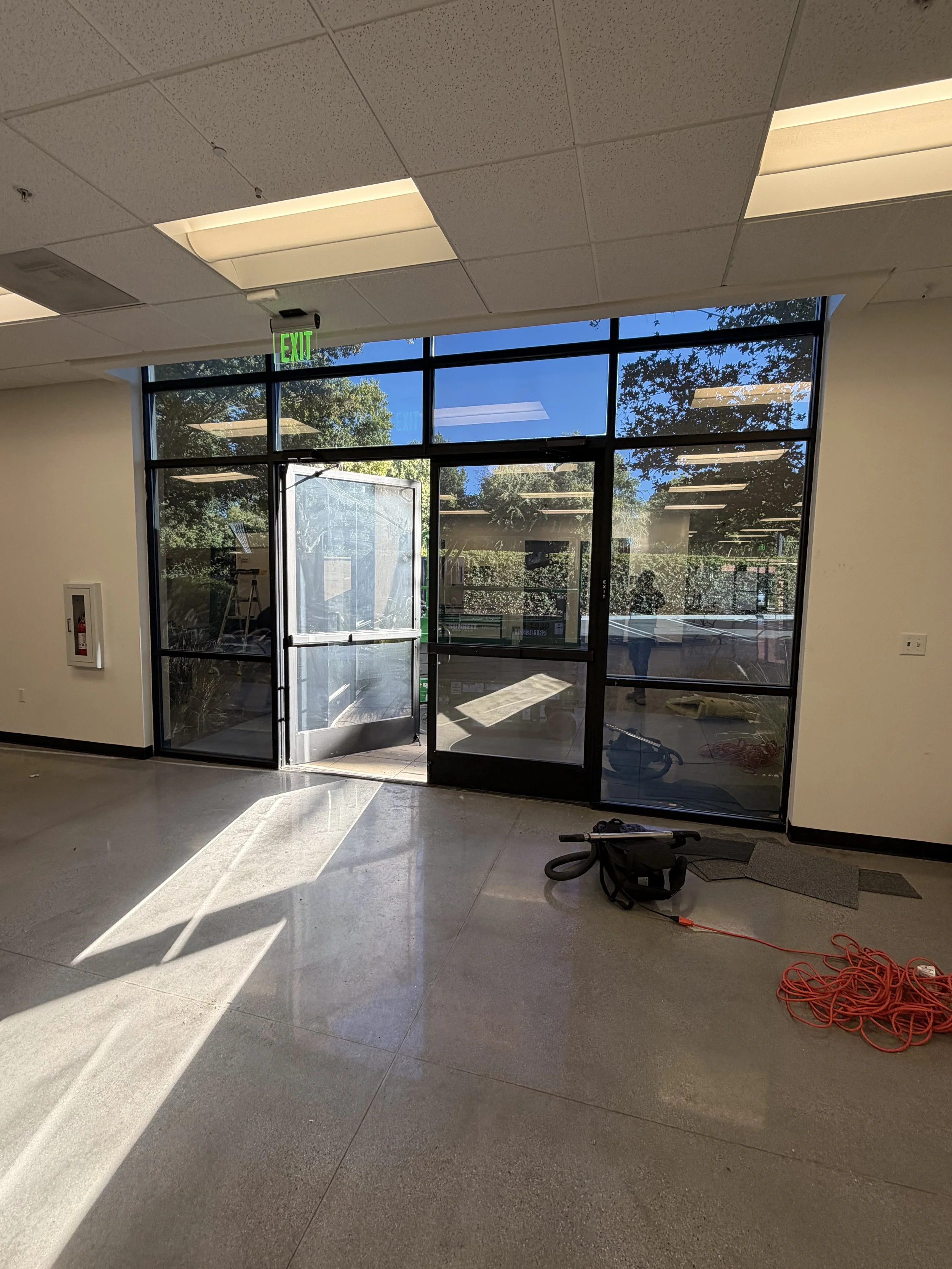 Glass storefront entry in a San Jose tenant space