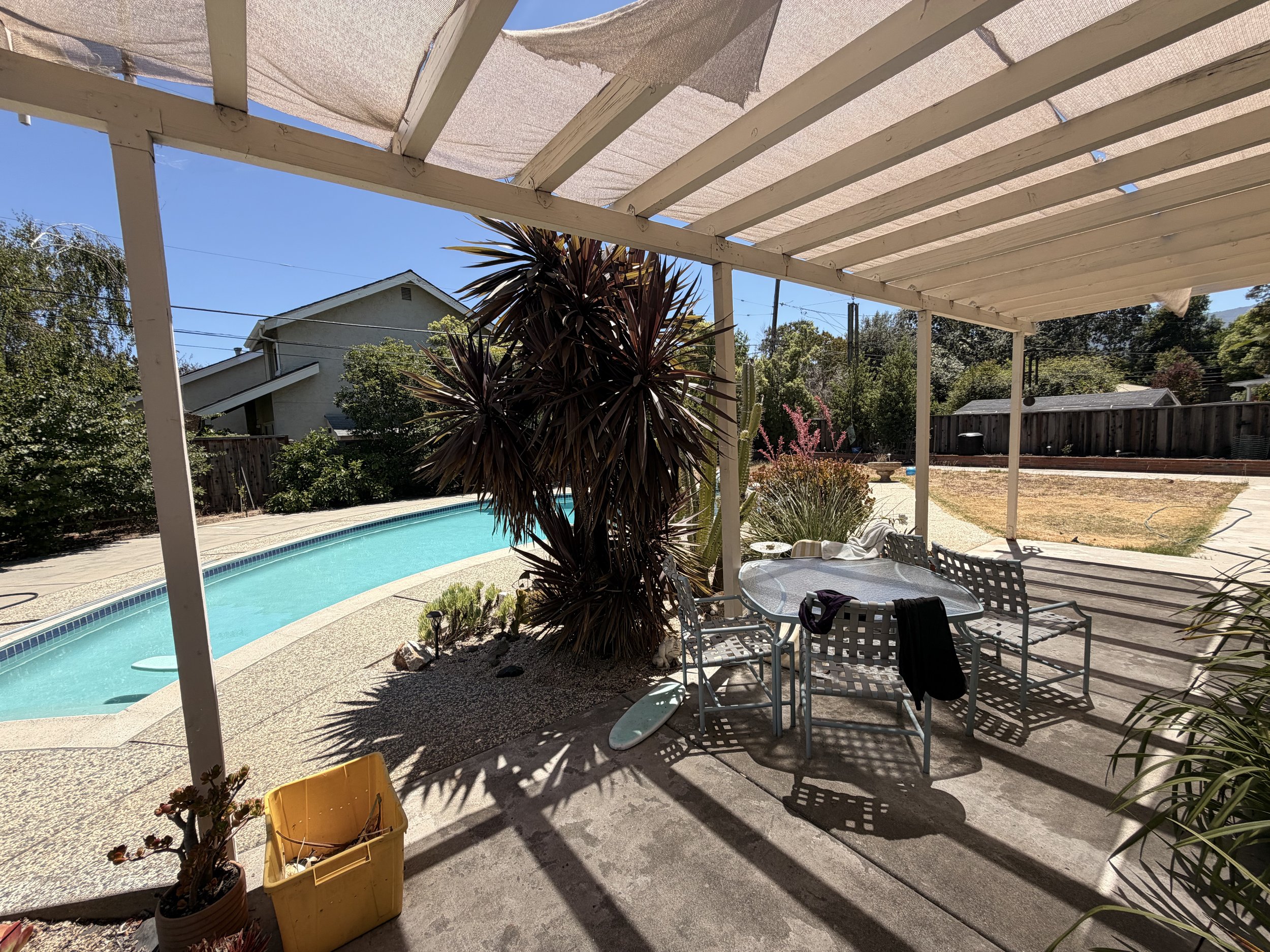 Pergola over a backyard pool area in San Jose
