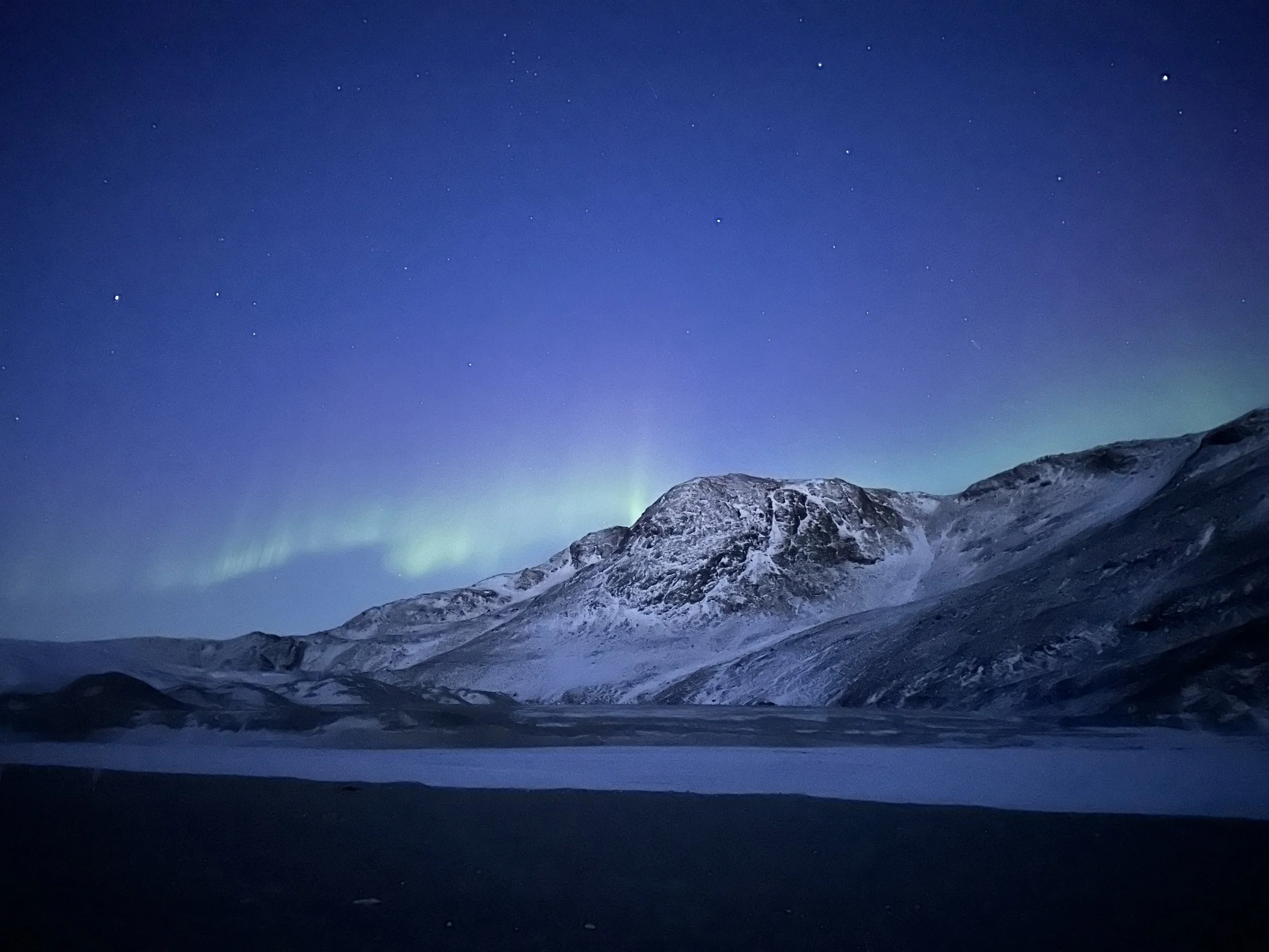 Aurora borealis over a glacier in Greenland