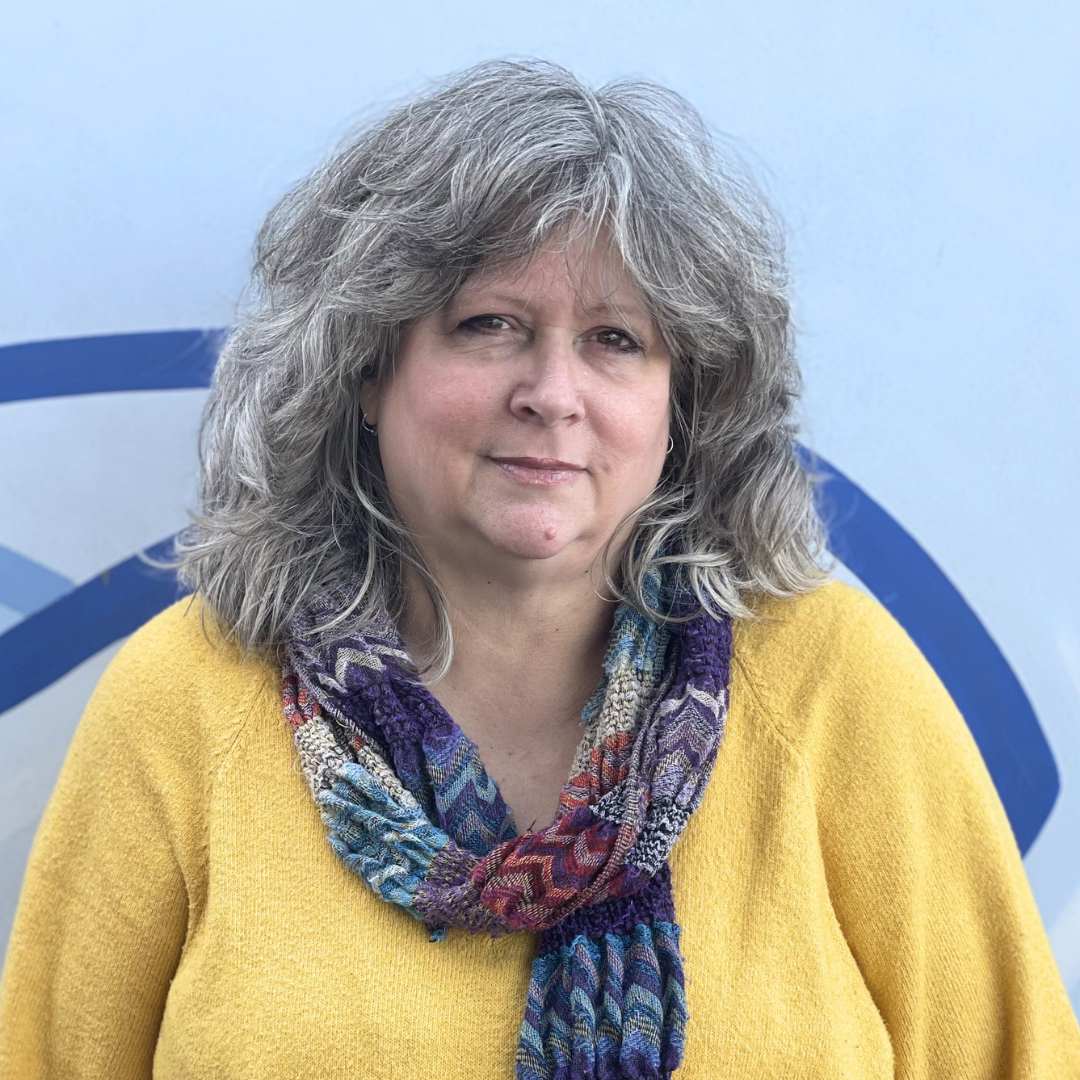Smiling Kathryn Bush in a yellow shirt