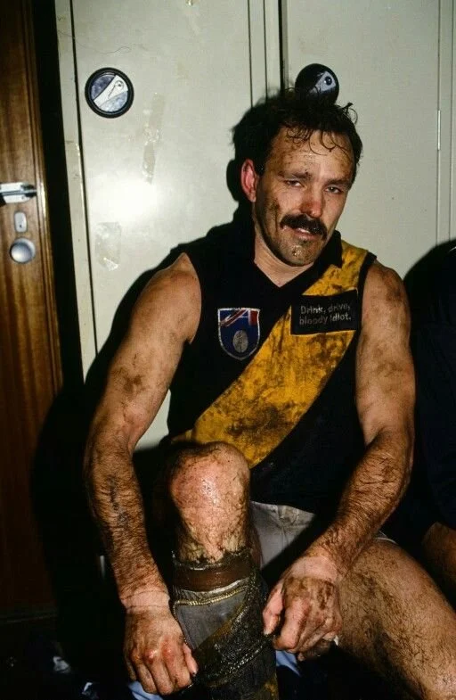 A Richmond player in the Marvel Stadium change rooms with the roof open