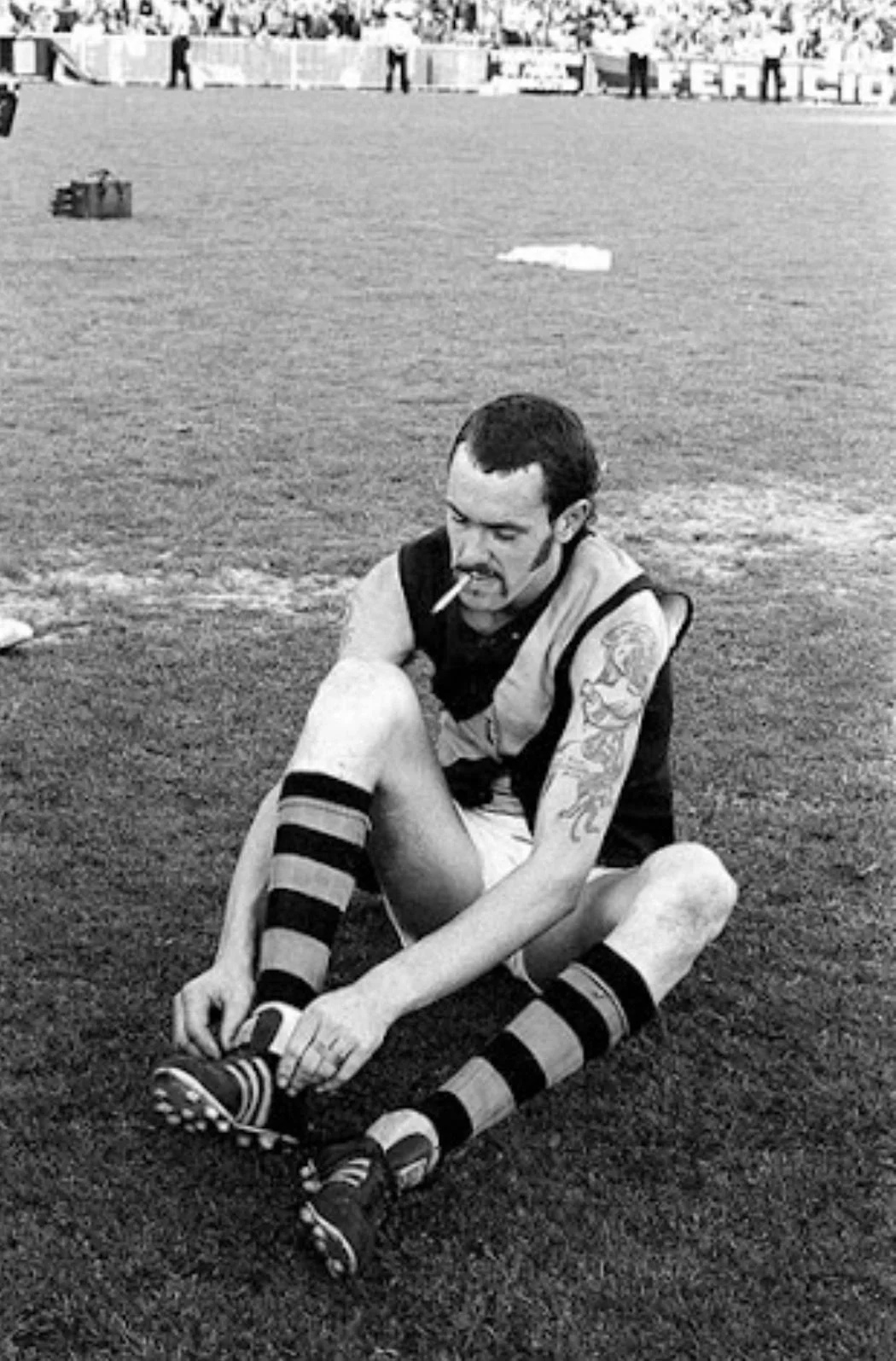 AFL player getting ready at Marvel Stadium with roof open