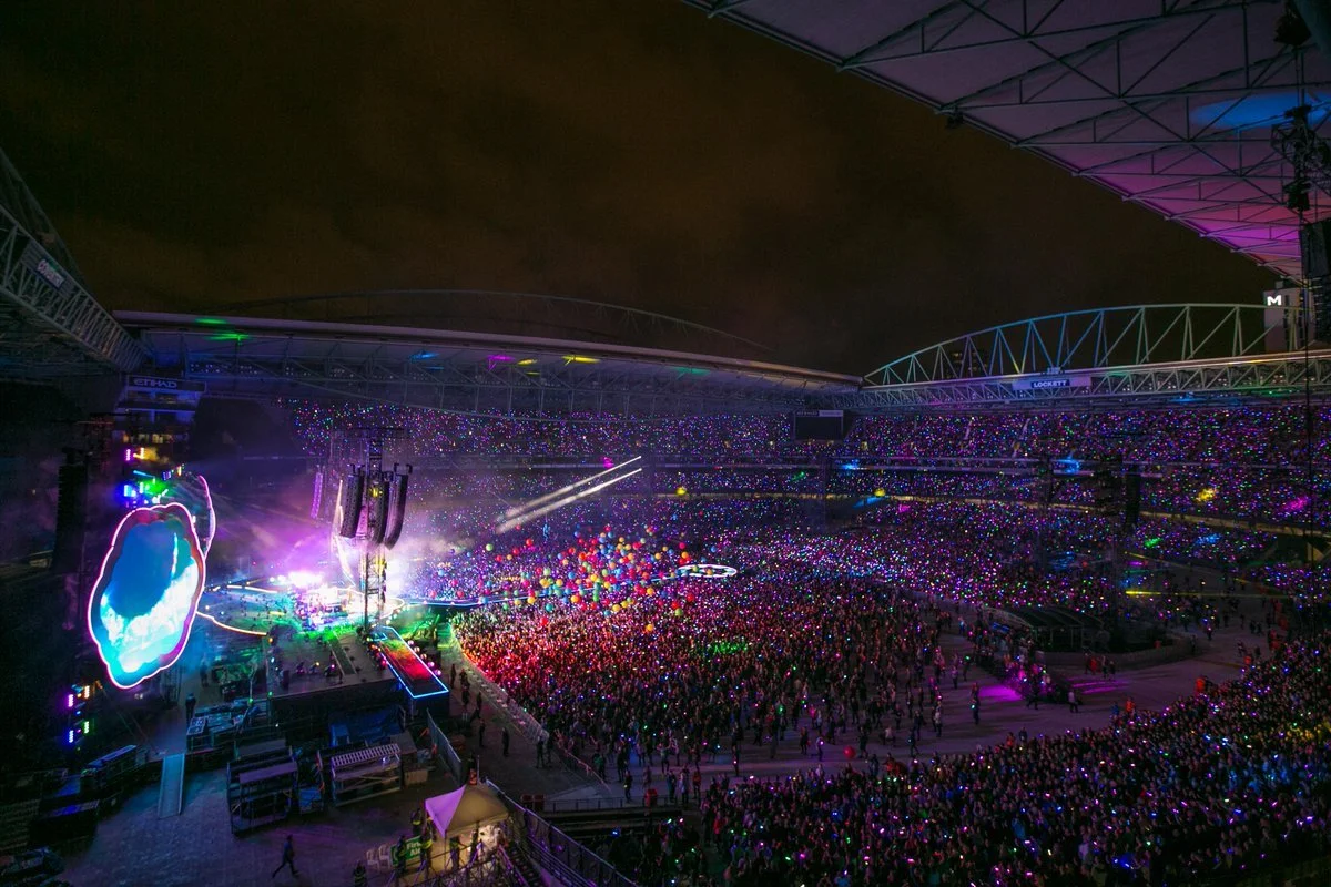 Marvel Stadium in Melbourne with the retractable roof open for a live concert, showing the open-air atmosphere fans experience when the Marvel Stadium roof is open.